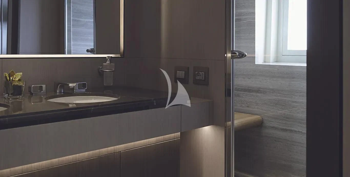 a bathroom with a sink and a mirror aboard CASA Yacht for Sale