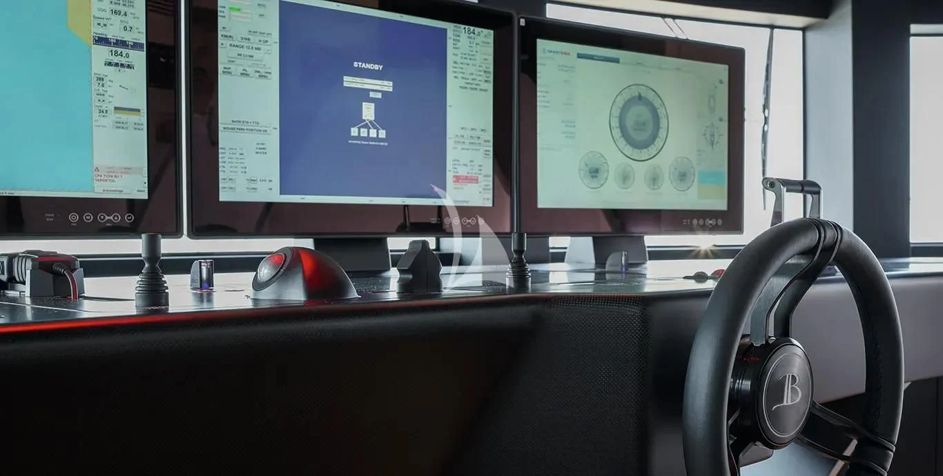 a computer desk with a monitor and a headphone aboard CASA Yacht for Sale