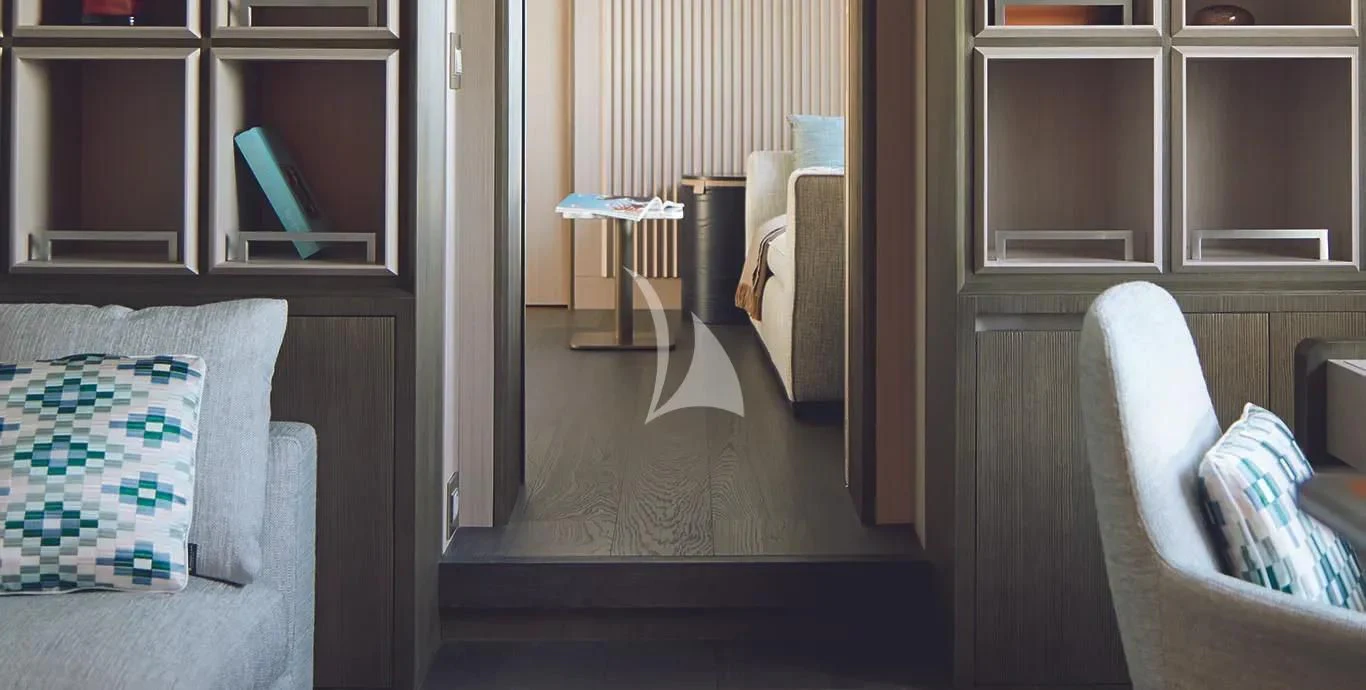 a room with a couch and a table aboard CASA Yacht for Sale