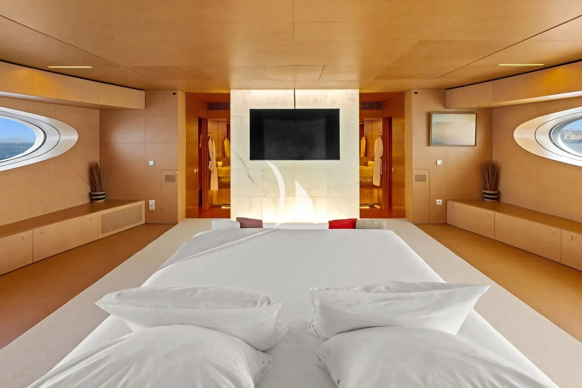 a room with a bed and a tv on the wall aboard LUISA Yacht for Charter