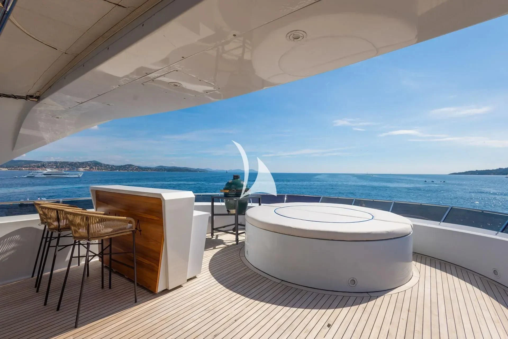 a large white tub on a deck overlooking the ocean aboard LUISA Yacht for Charter