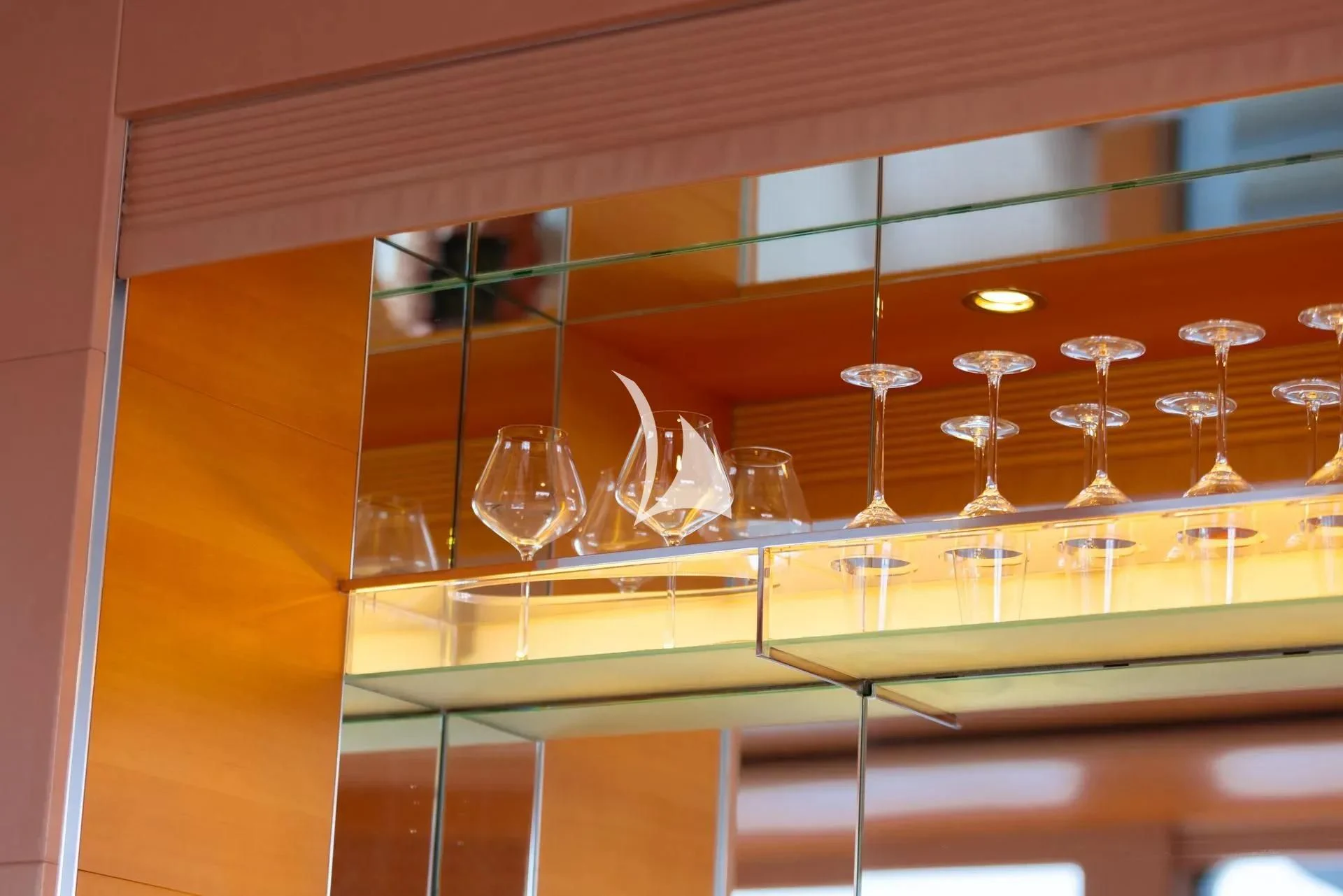 a group of glasses on display aboard LUISA Yacht for Charter