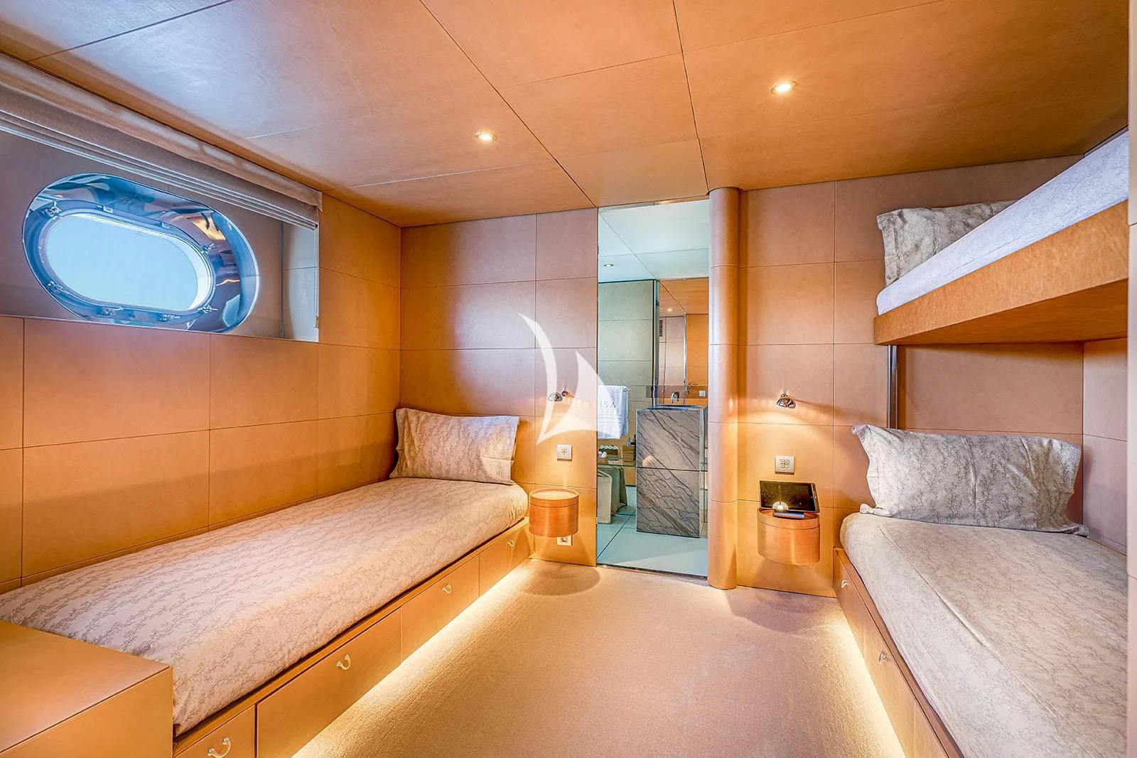 a bedroom with a bed and a mirror aboard LUISA Yacht for Charter