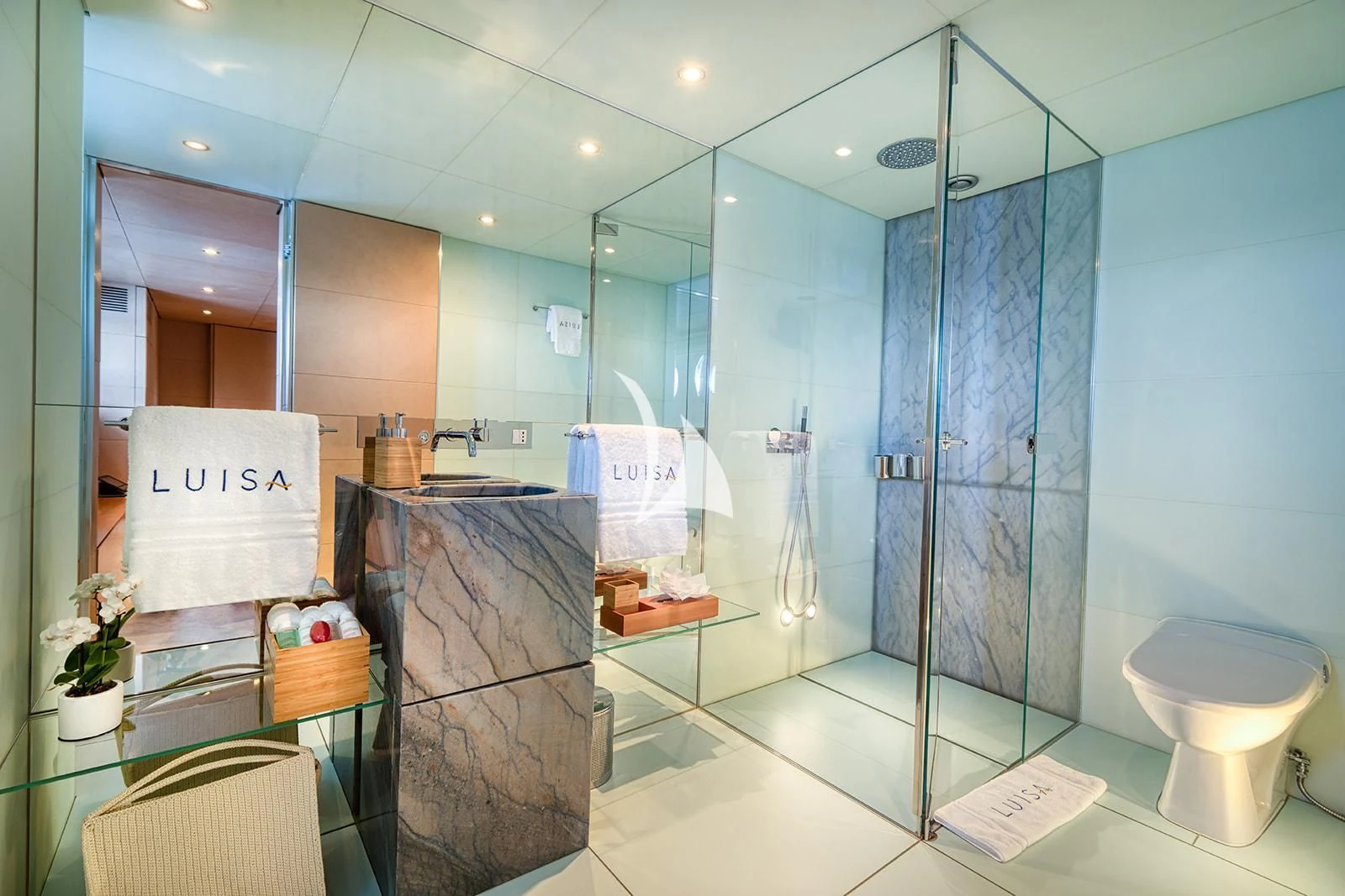 a bathroom with a glass shower aboard LUISA Yacht for Charter