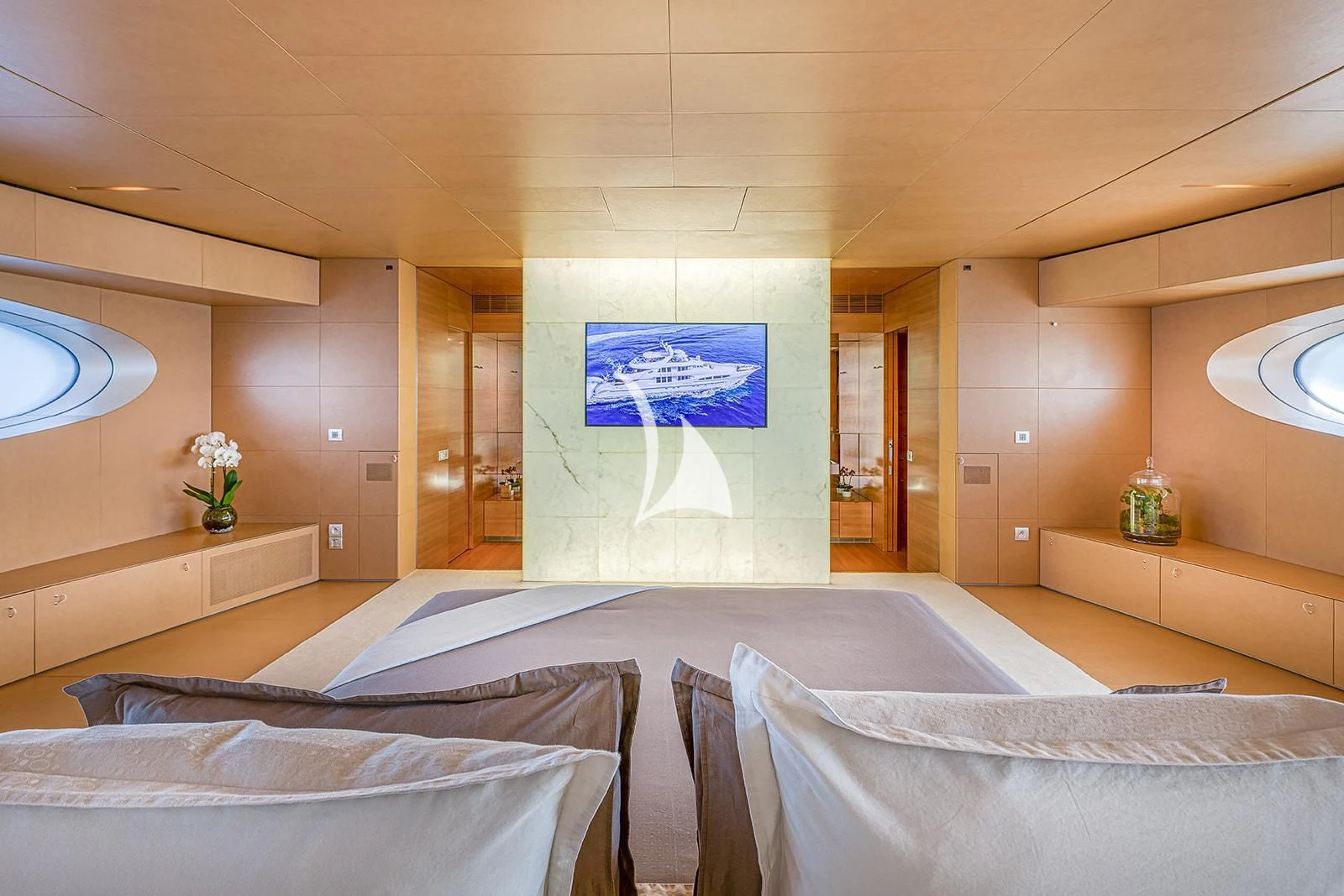a room with a bed and a painting on the wall aboard LUISA Yacht for Charter