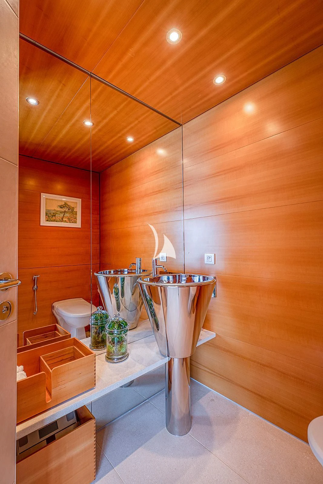 a bathroom with a sink and a toilet aboard LUISA Yacht for Charter