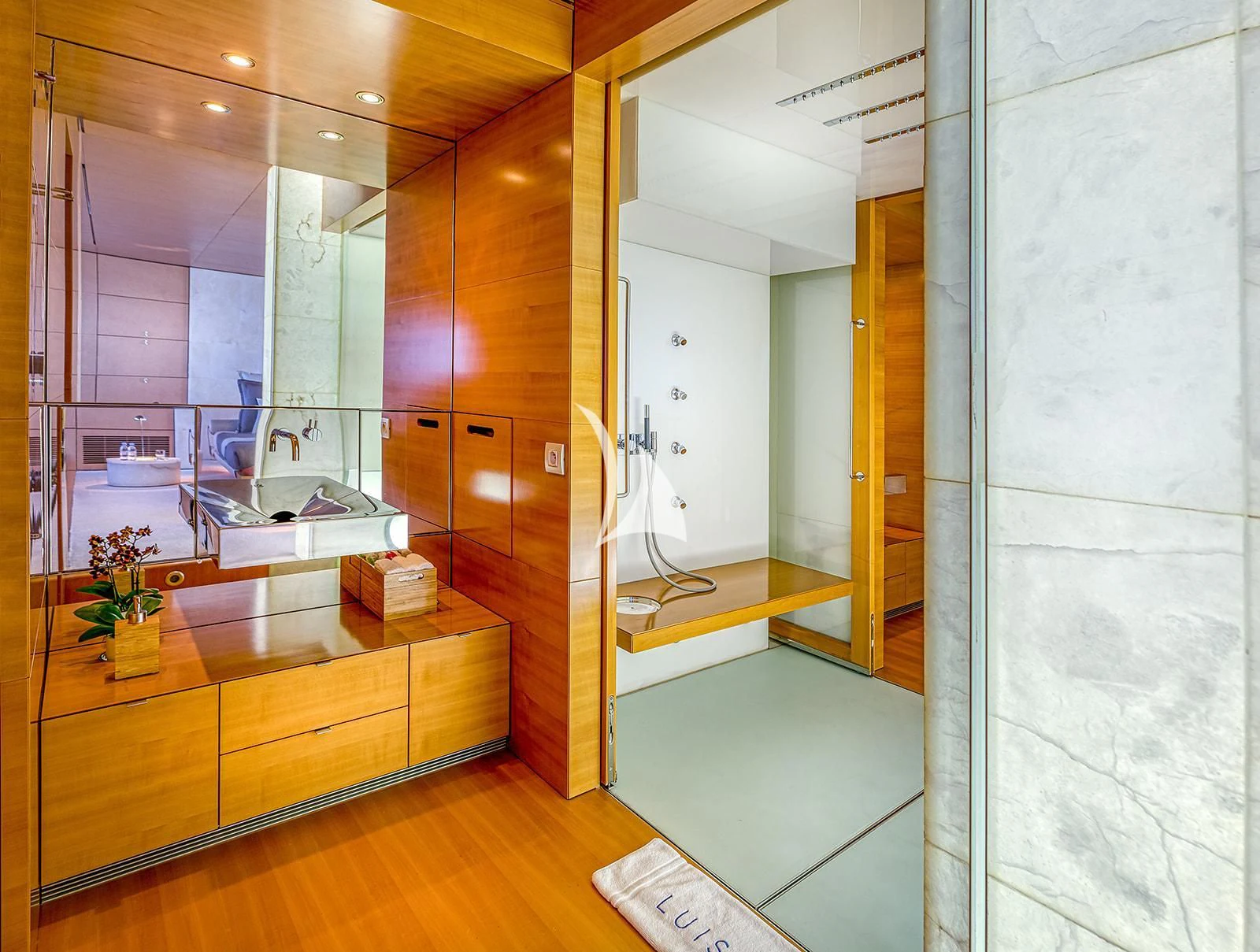 a bathroom with a glass shower aboard LUISA Yacht for Charter