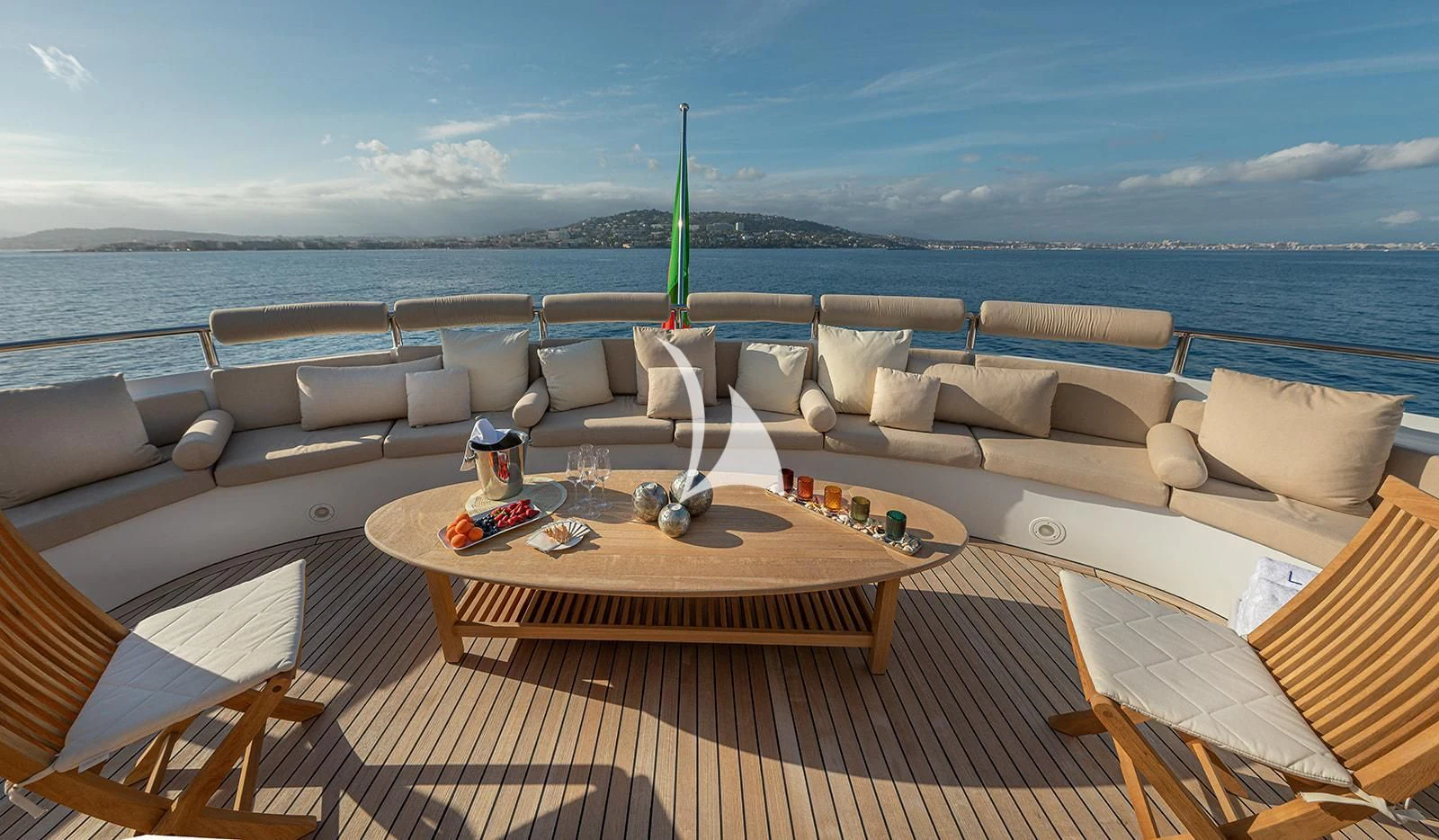 a table with chairs and a pool in the background aboard LUISA Yacht for Charter