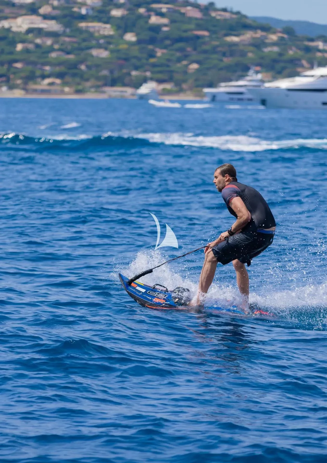 a man is water skiing aboard LUISA Yacht for Charter