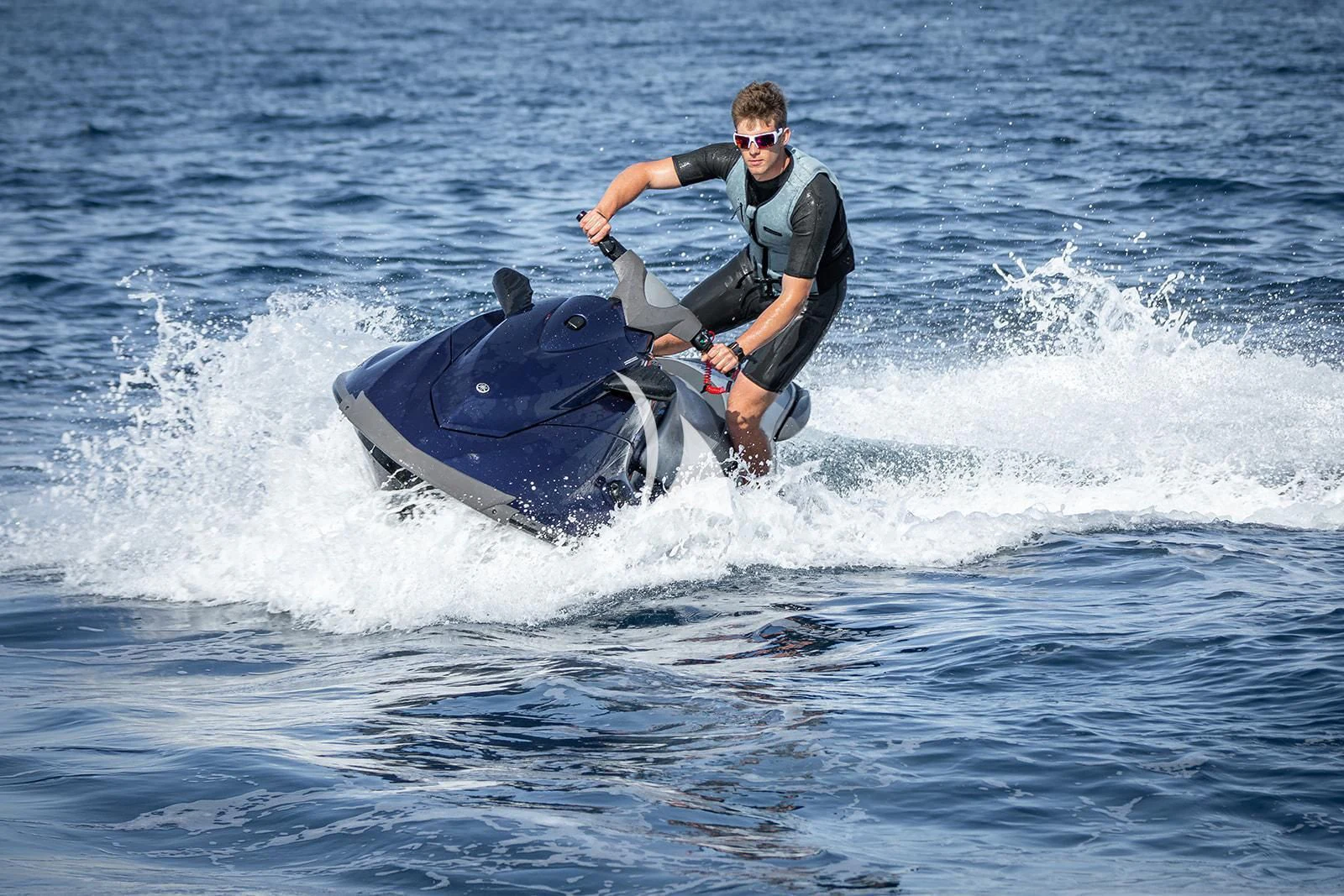 a man riding a jet ski aboard LUISA Yacht for Charter