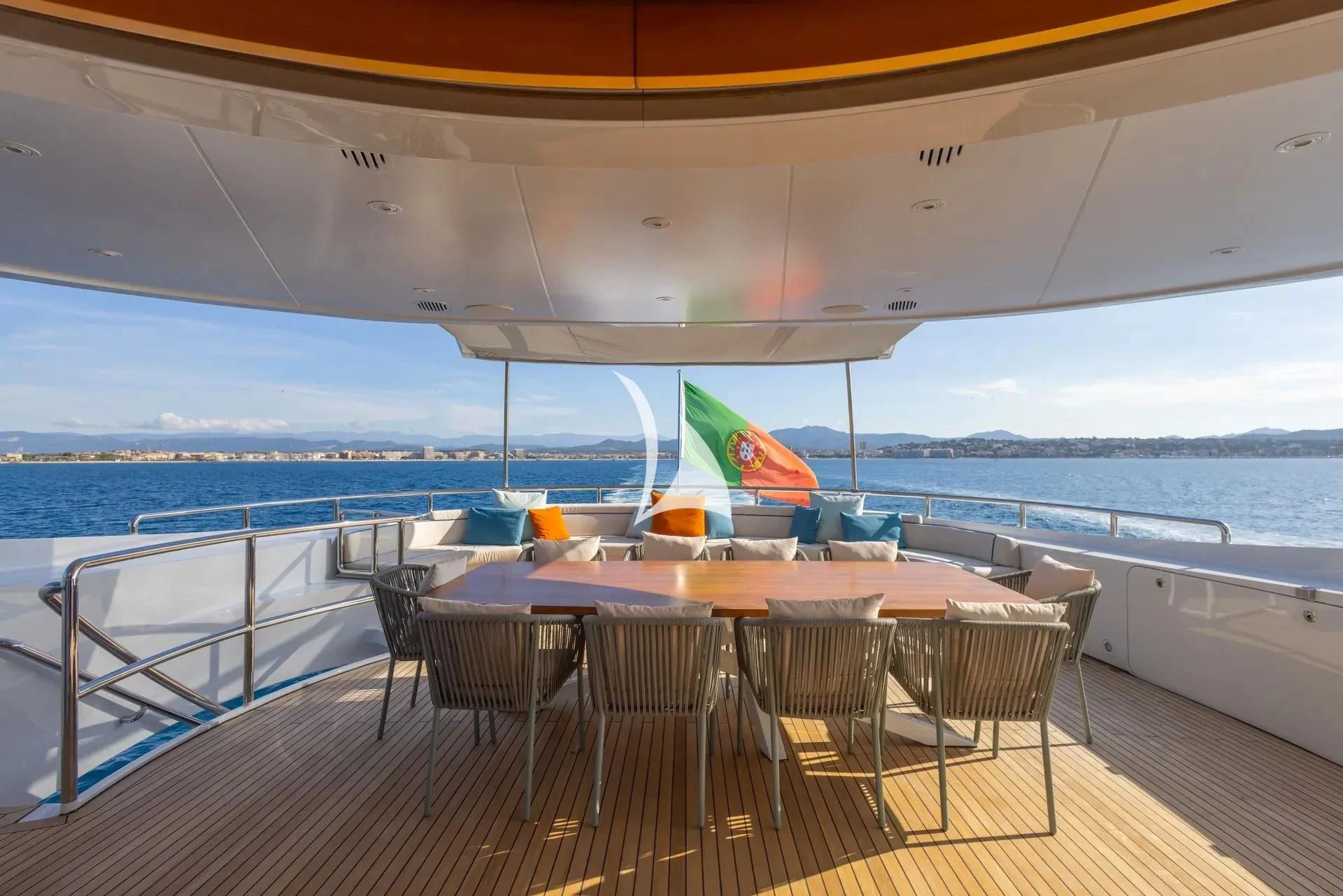 a deck with tables and chairs on it aboard LUISA Yacht for Charter