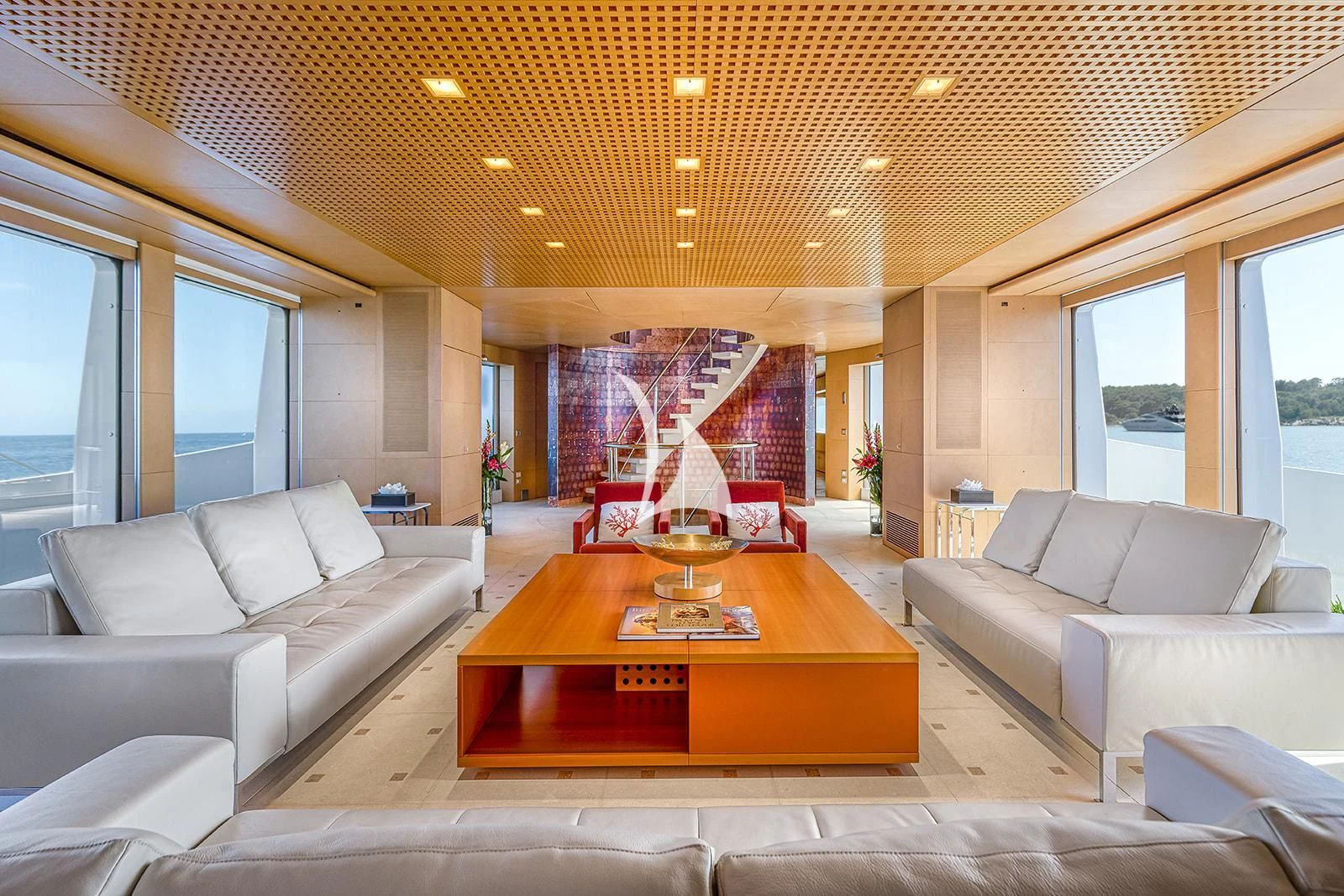 a living room with a table and couches aboard LUISA Yacht for Charter