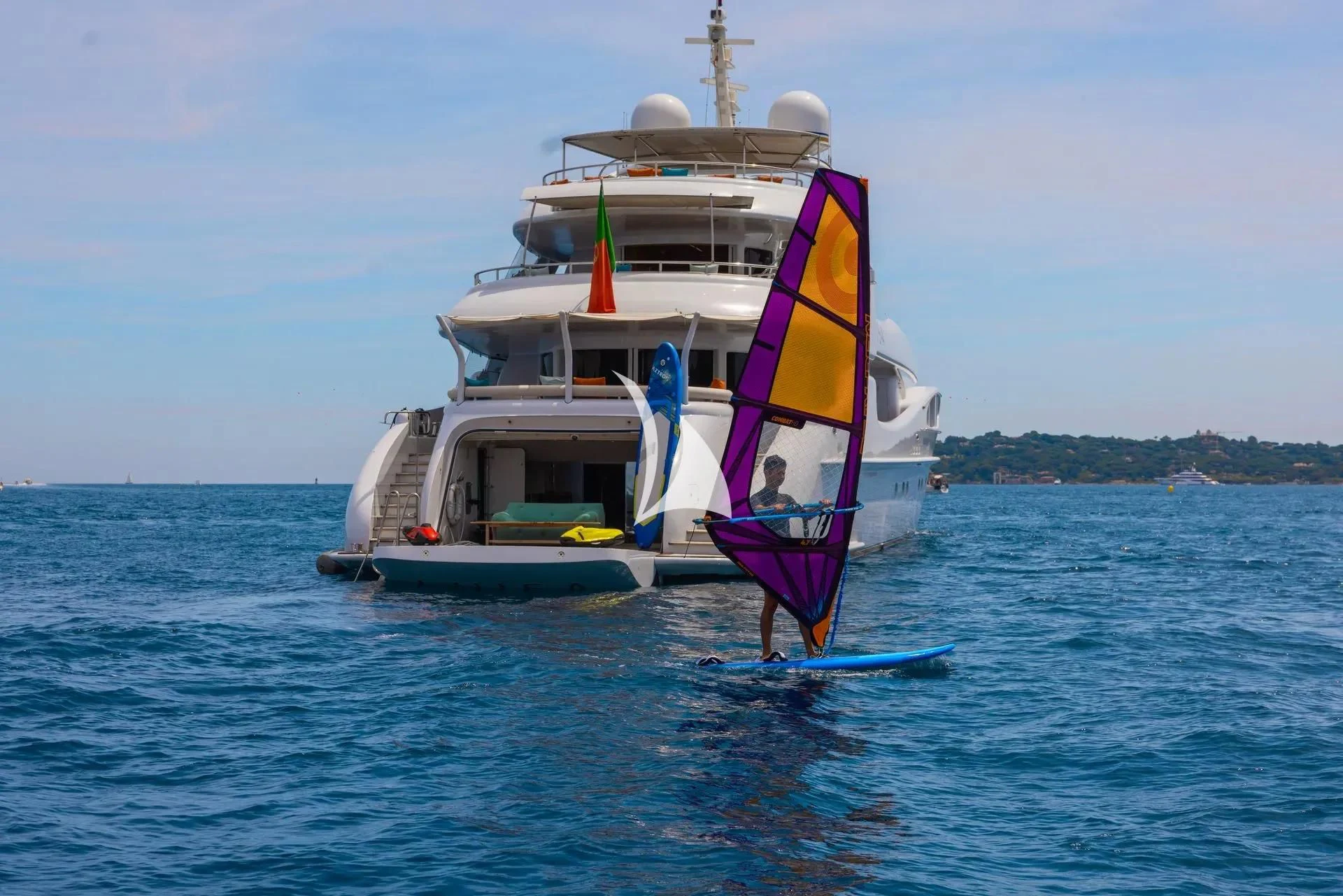 a boat with a flag on it aboard LUISA Yacht for Charter