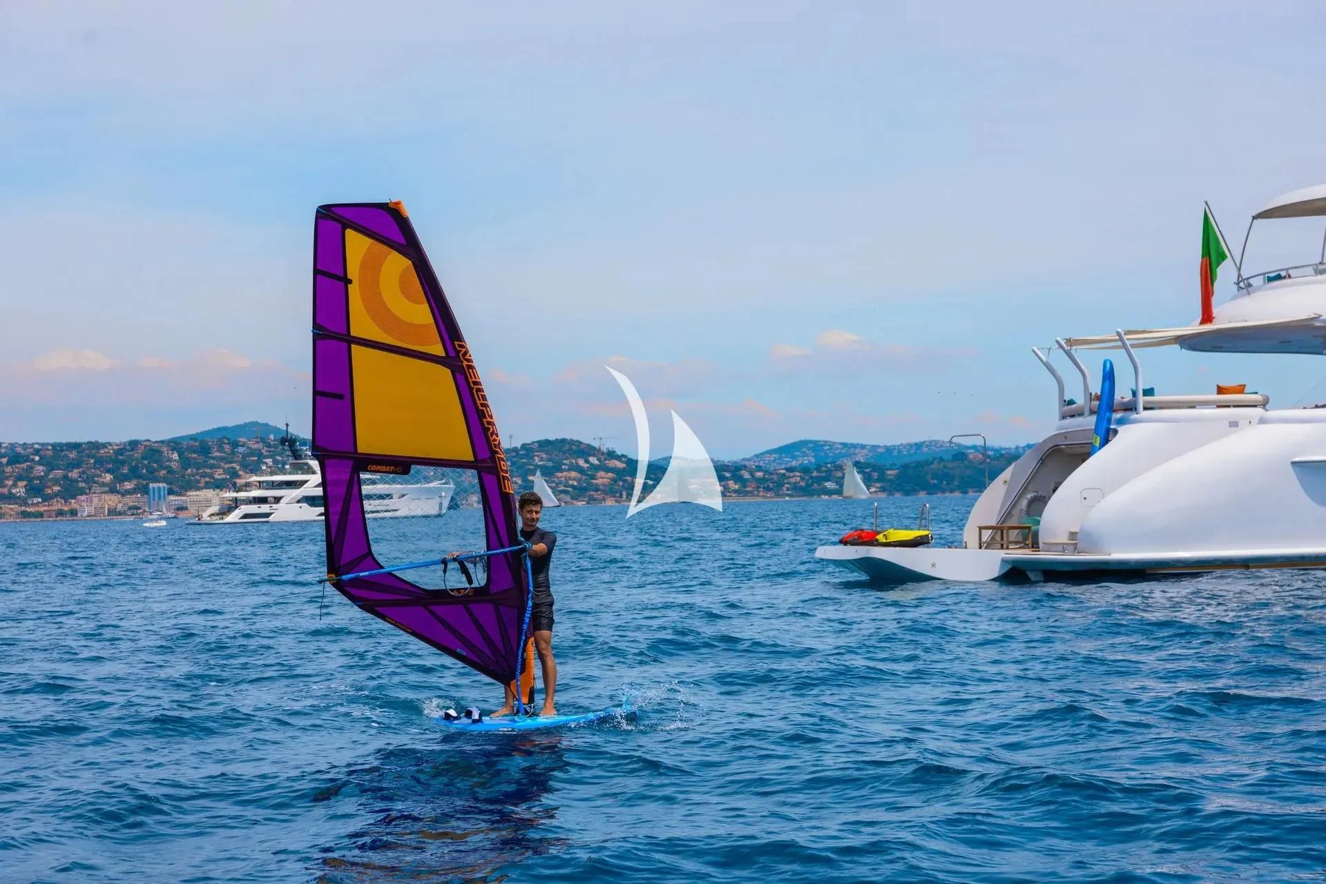 a person on a sailboard in the water aboard LUISA Yacht for Charter