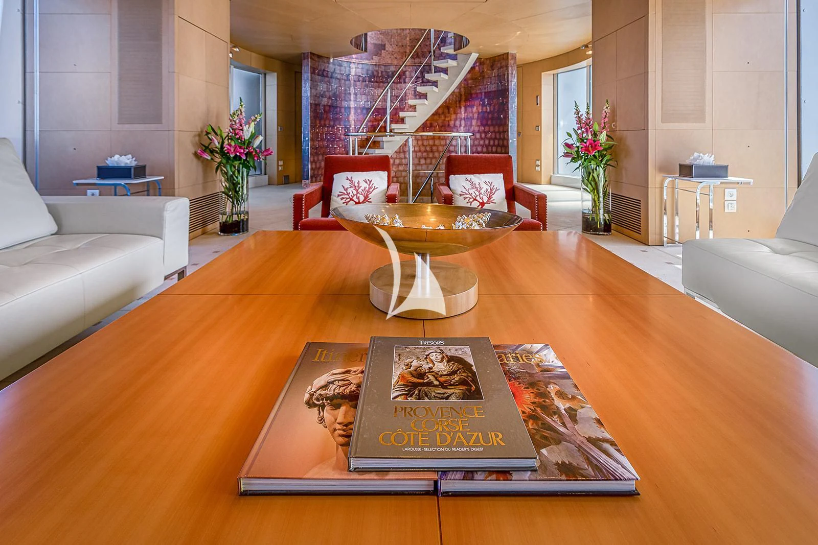 a living room with a table and couches aboard LUISA Yacht for Charter