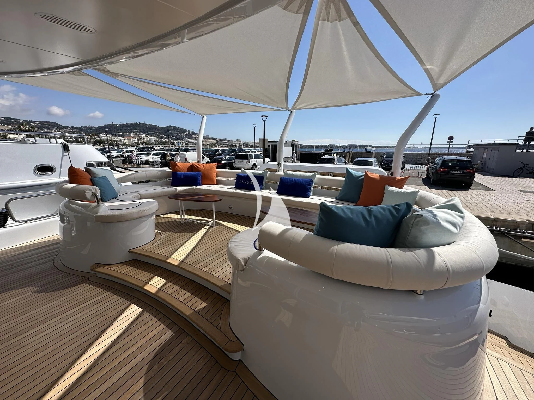 a boat with a couch and chairs aboard LUISA Yacht for Charter