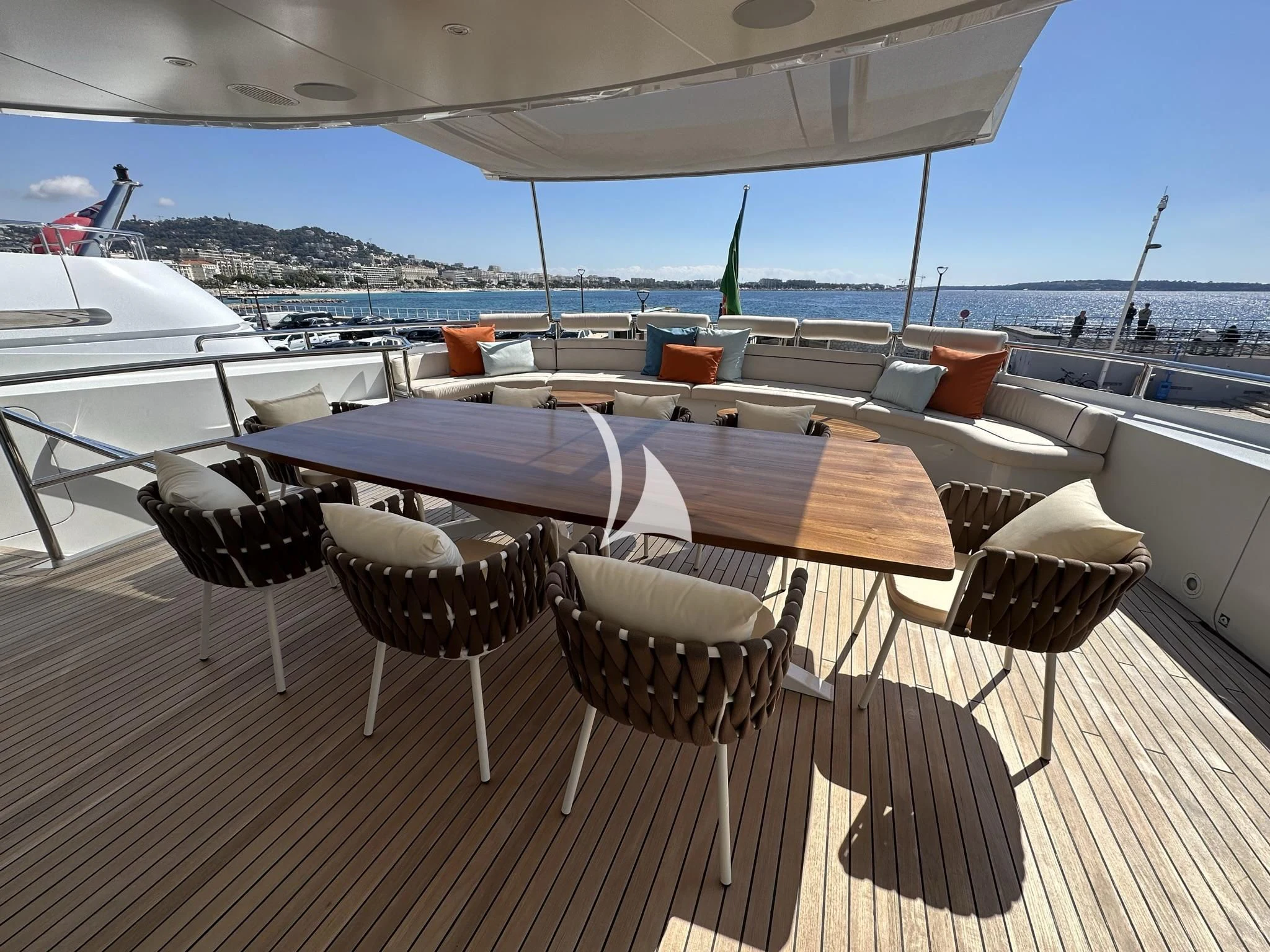 a table and chairs on a deck aboard LUISA Yacht for Charter