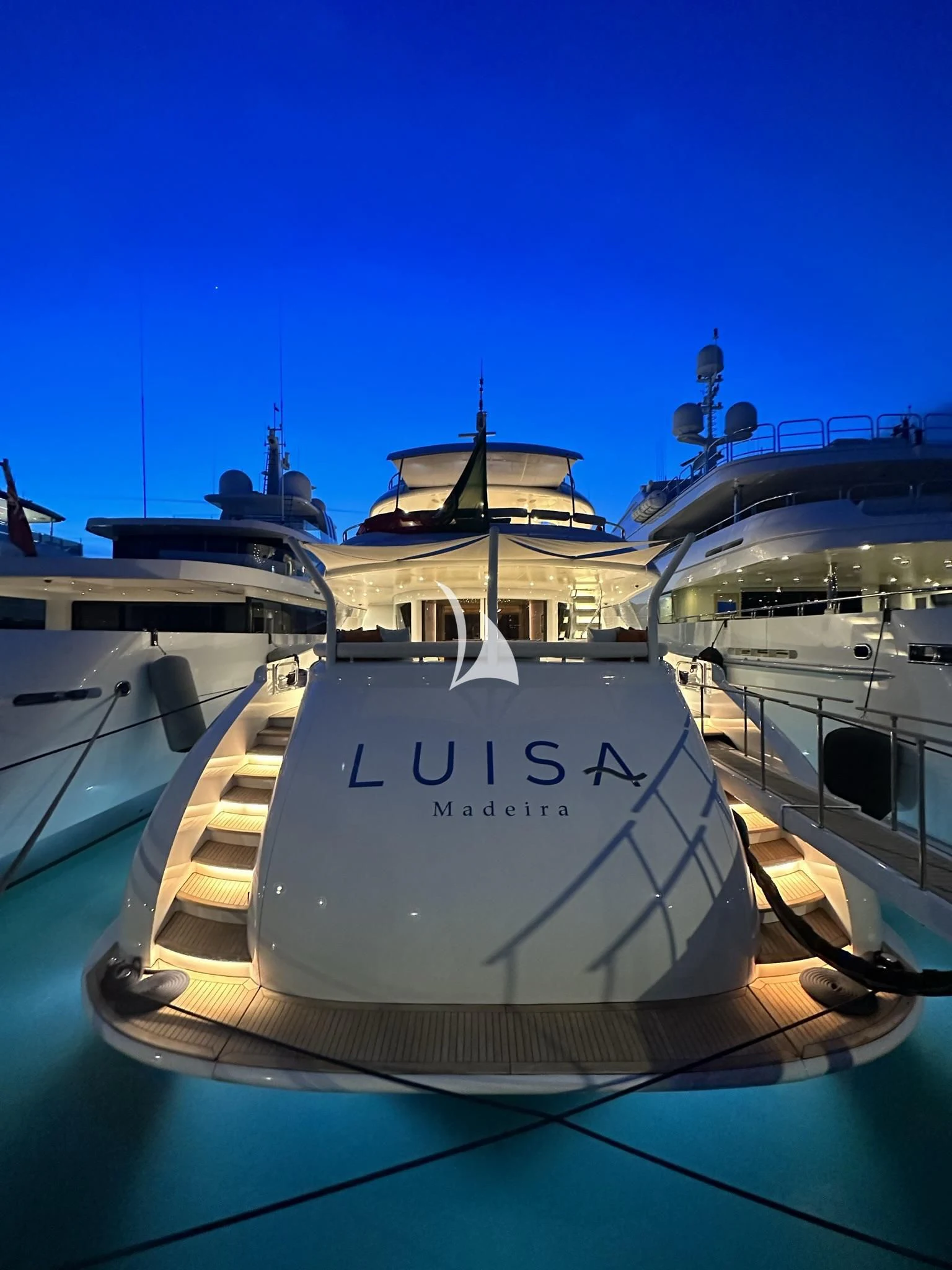 a boat in a harbor aboard LUISA Yacht for Charter
