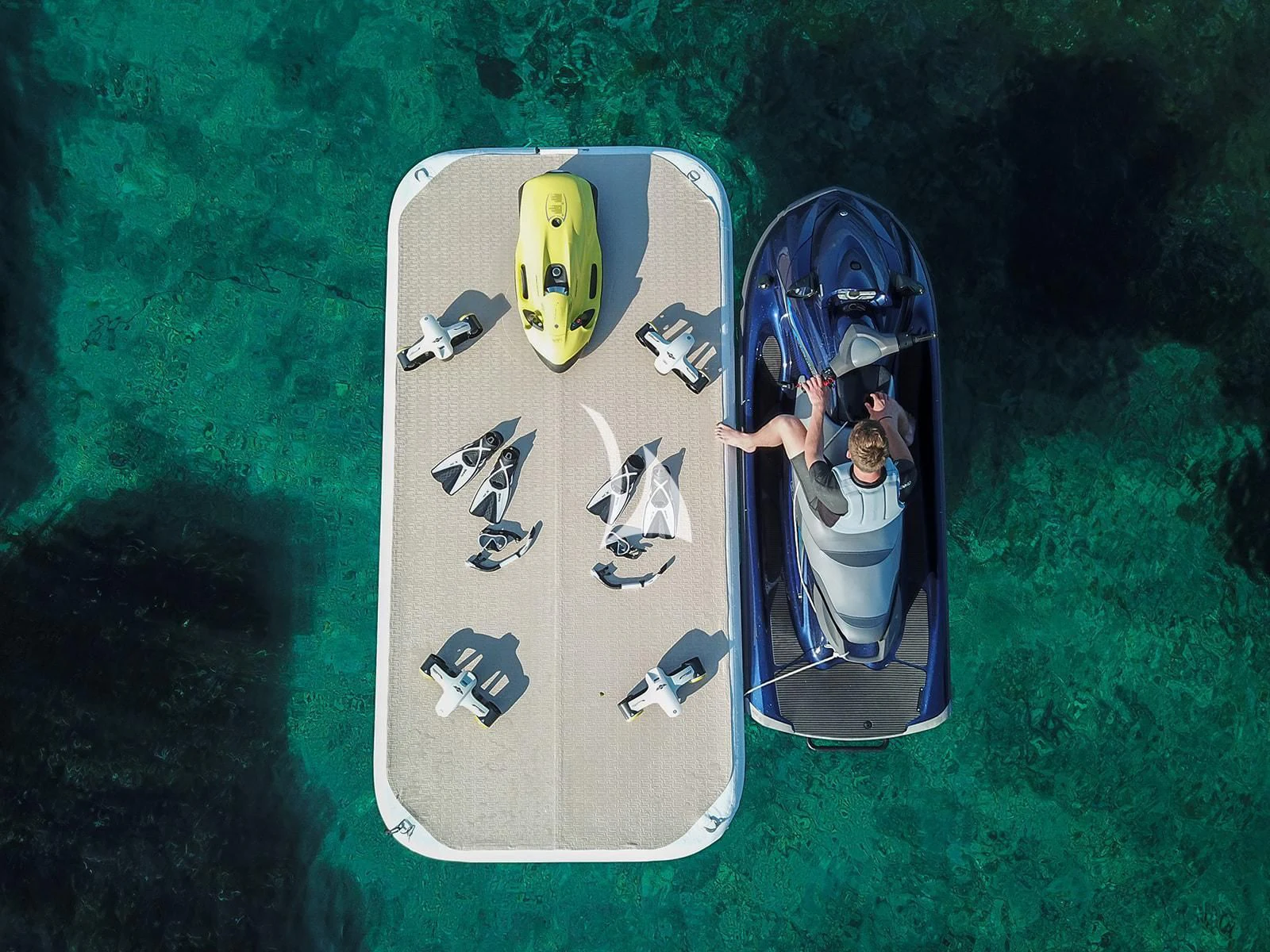 a couple of surfboards on a green lawn aboard LUISA Yacht for Charter