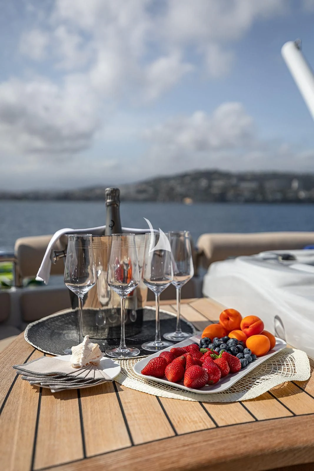 a table with glasses and fruit on it aboard LUISA Yacht for Charter