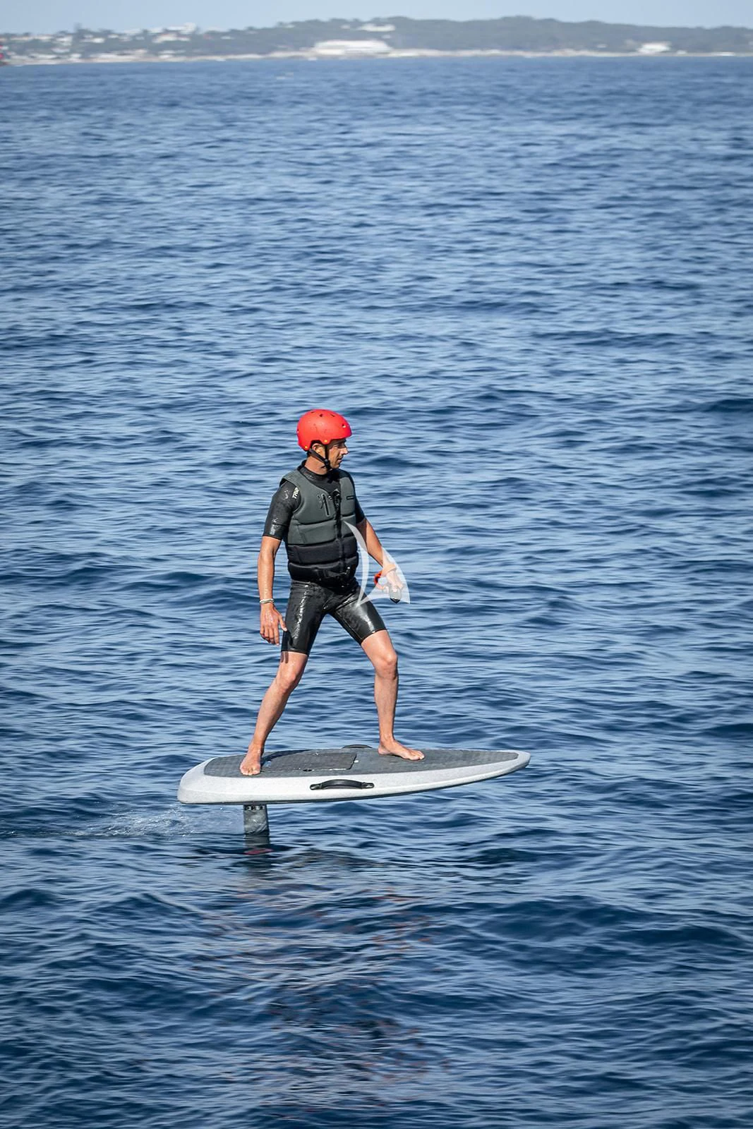 a man on a surfboard aboard LUISA Yacht for Charter
