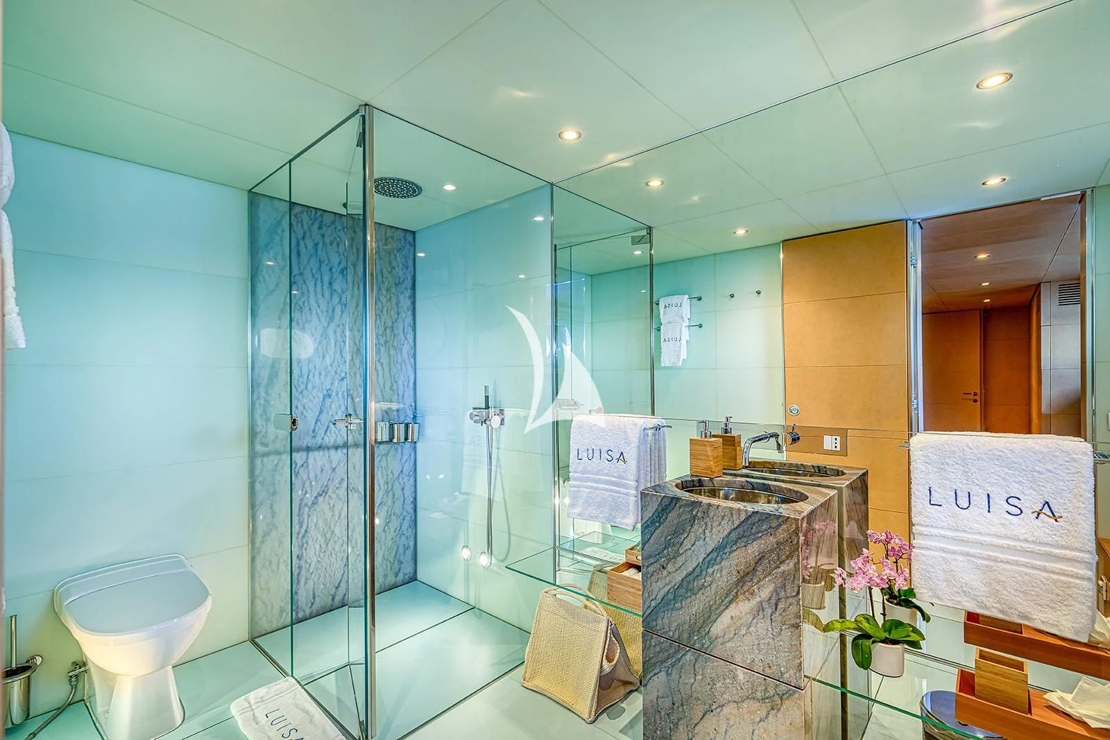 a bathroom with a glass shower aboard LUISA Yacht for Charter