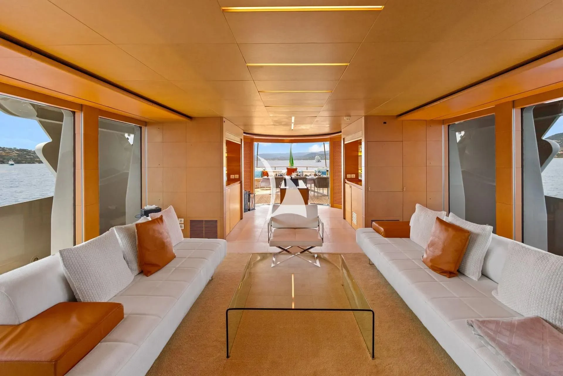 a room with a bed and a table aboard LUISA Yacht for Charter