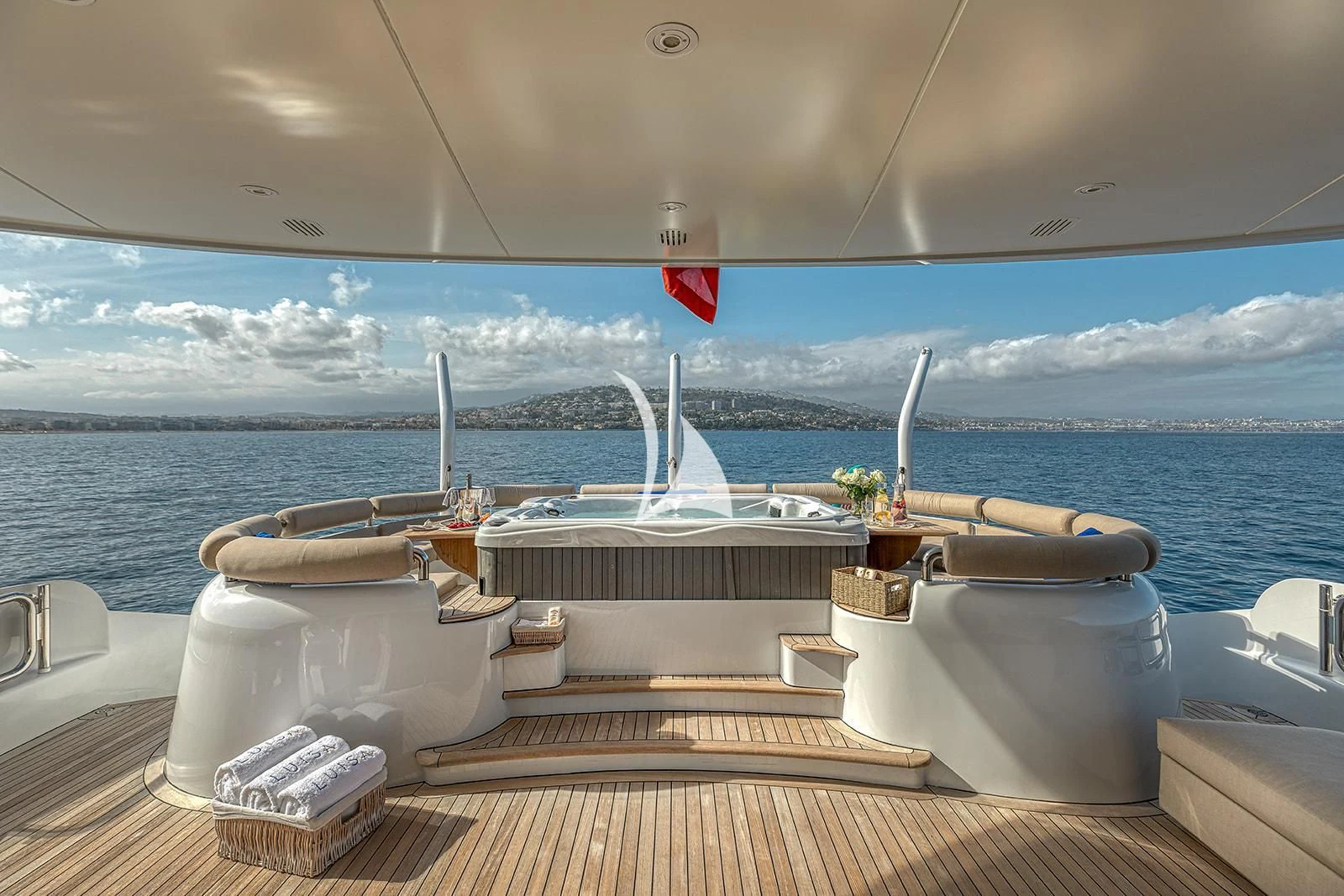 a boat on a deck overlooking the ocean aboard LUISA Yacht for Charter