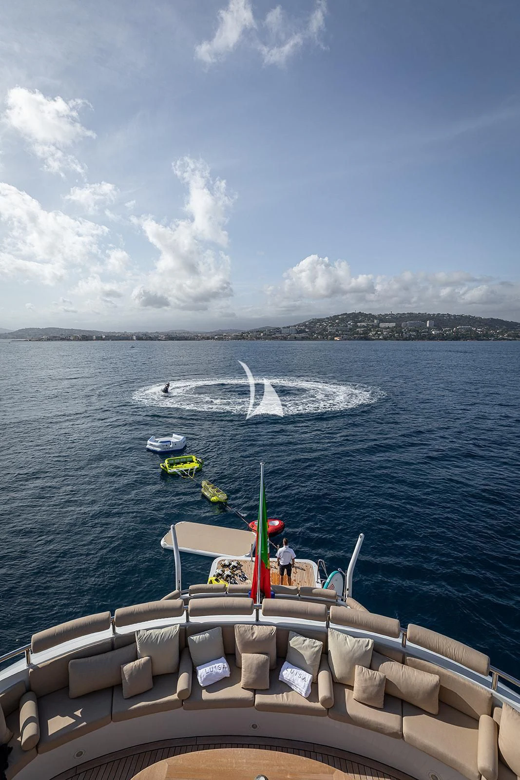 a boat with a sail on the water aboard LUISA Yacht for Charter