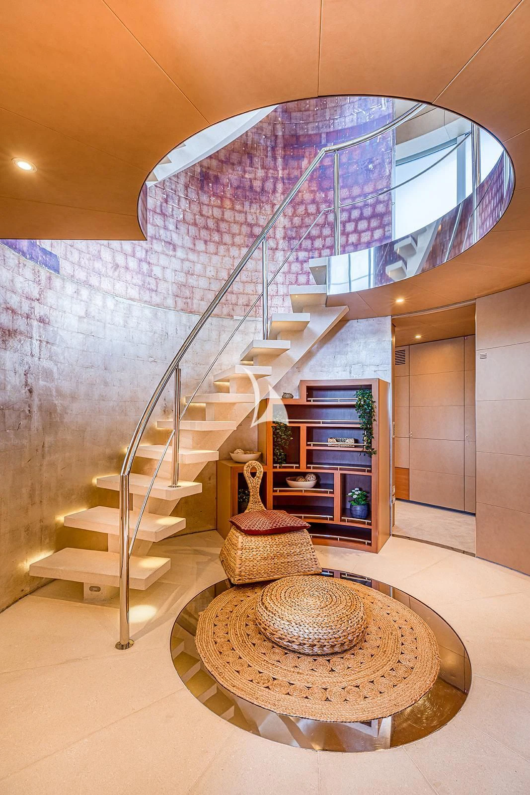 a staircase with a round table aboard LUISA Yacht for Charter
