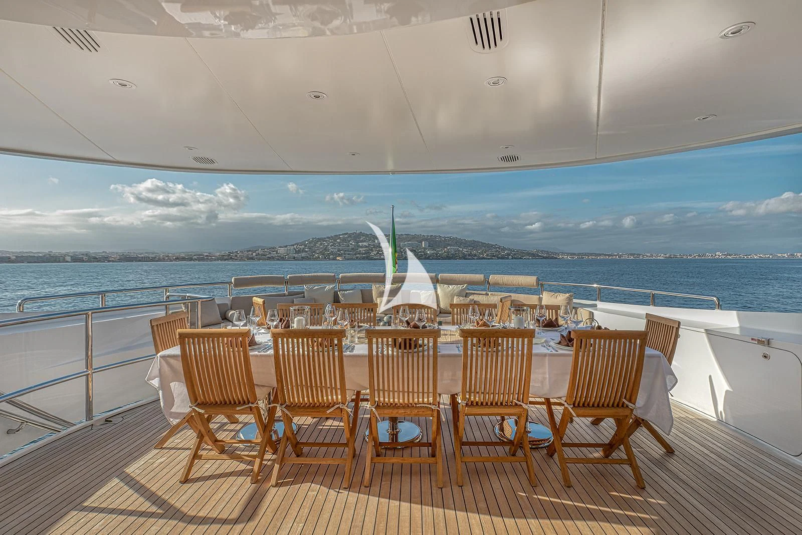 a deck with chairs and a view of the ocean aboard LUISA Yacht for Charter
