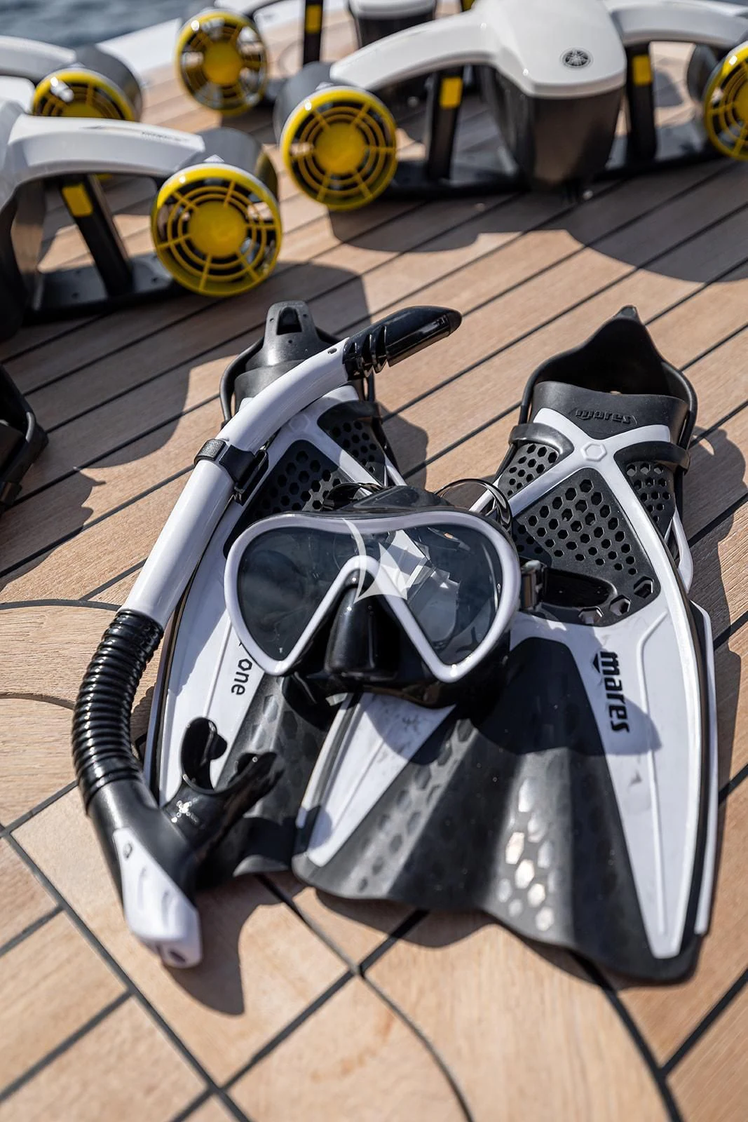 a white and black motorcycle aboard LUISA Yacht for Charter