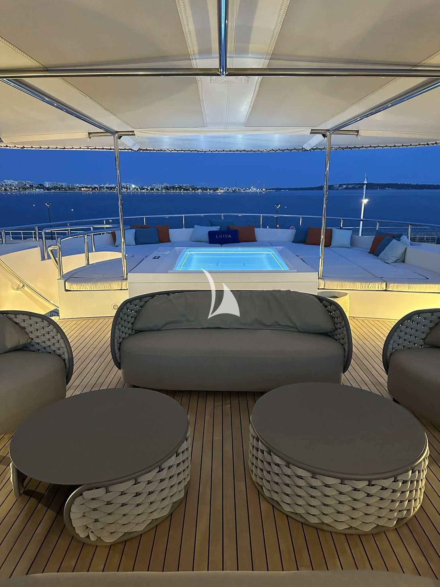 a lounge area with a pool aboard LUISA Yacht for Charter