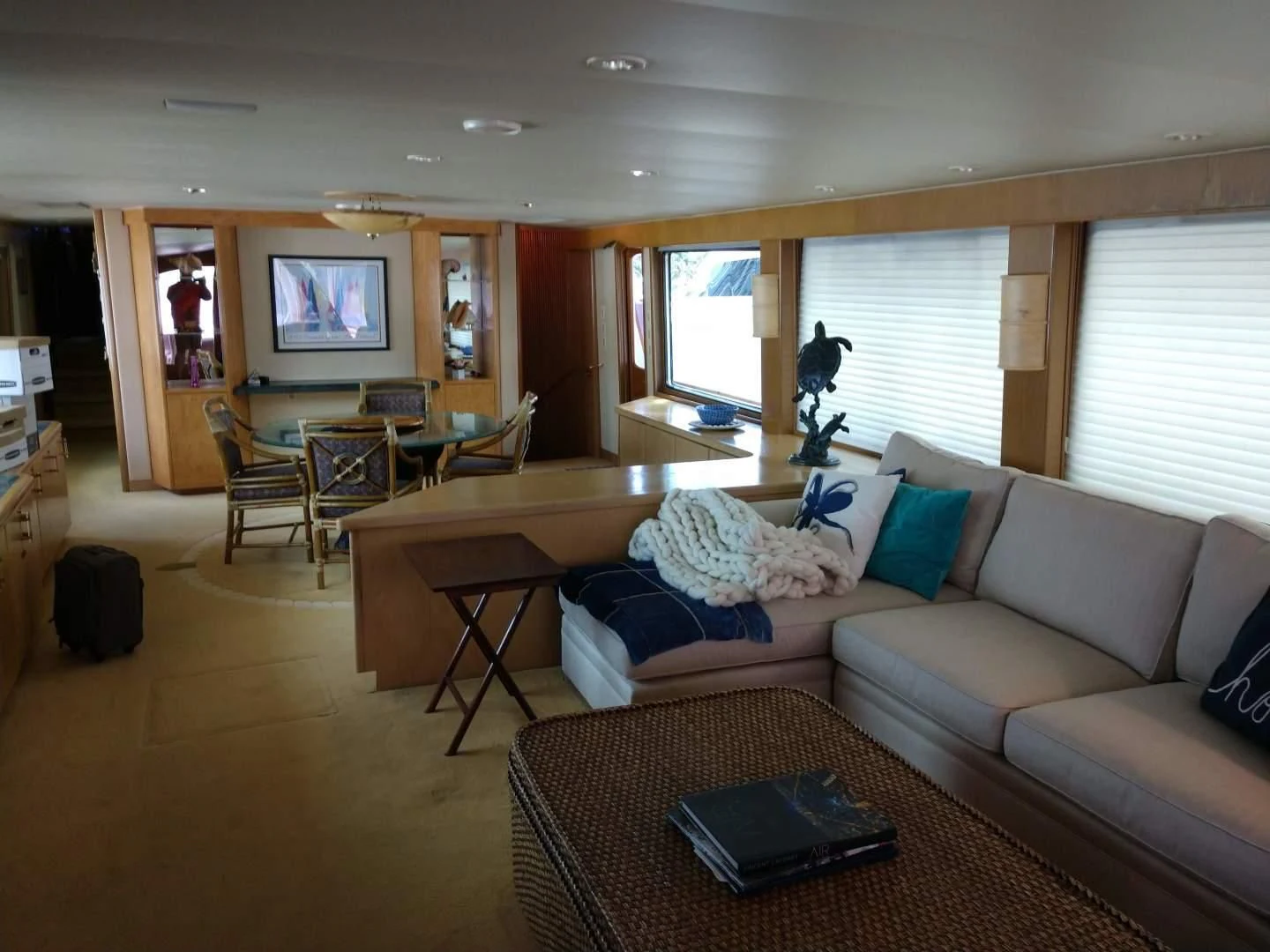 a living room with a couch and a table aboard CAROLE TOO Yacht for Sale