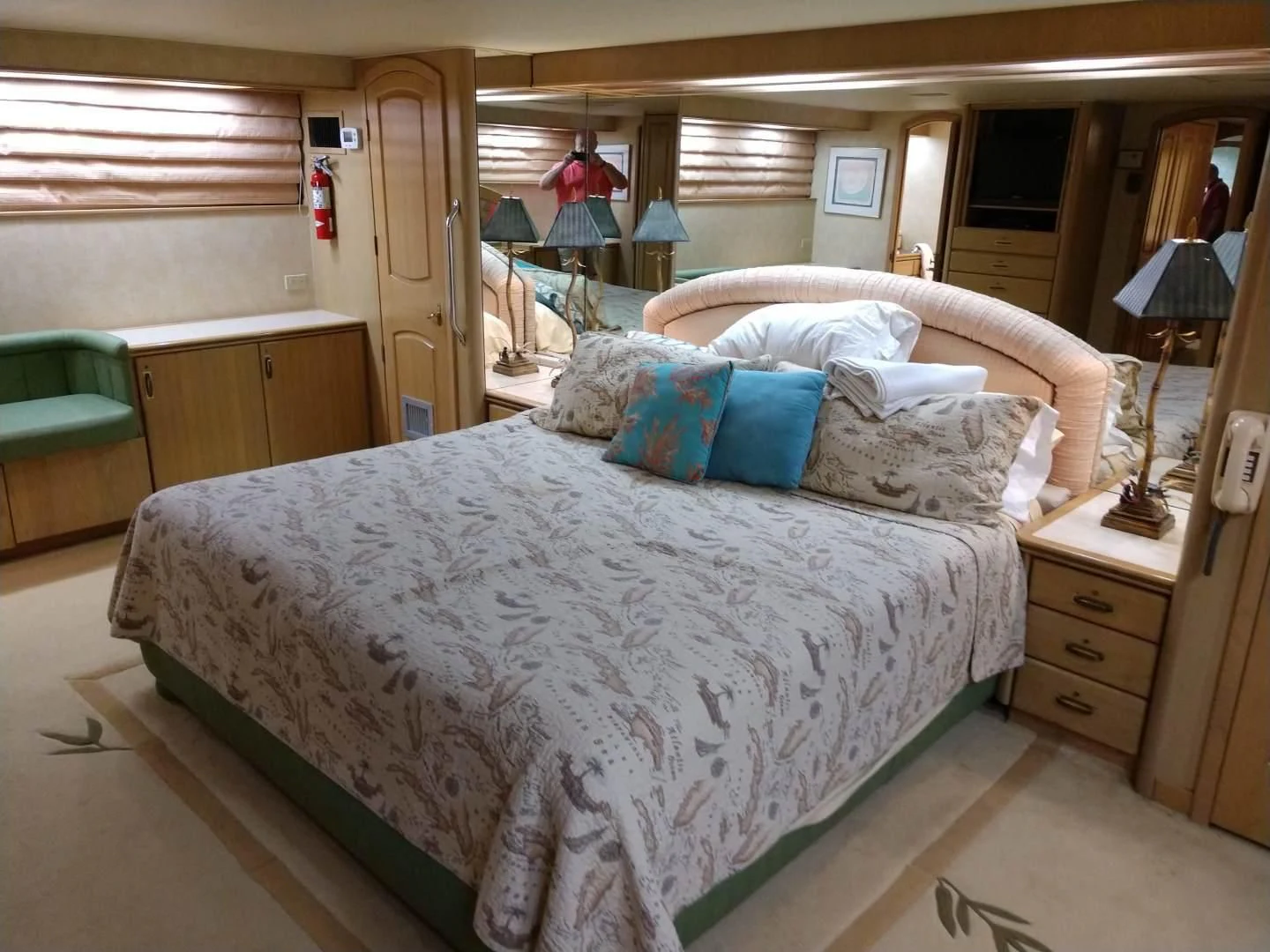 a bed with a blue and white comforter aboard CAROLE TOO Yacht for Sale