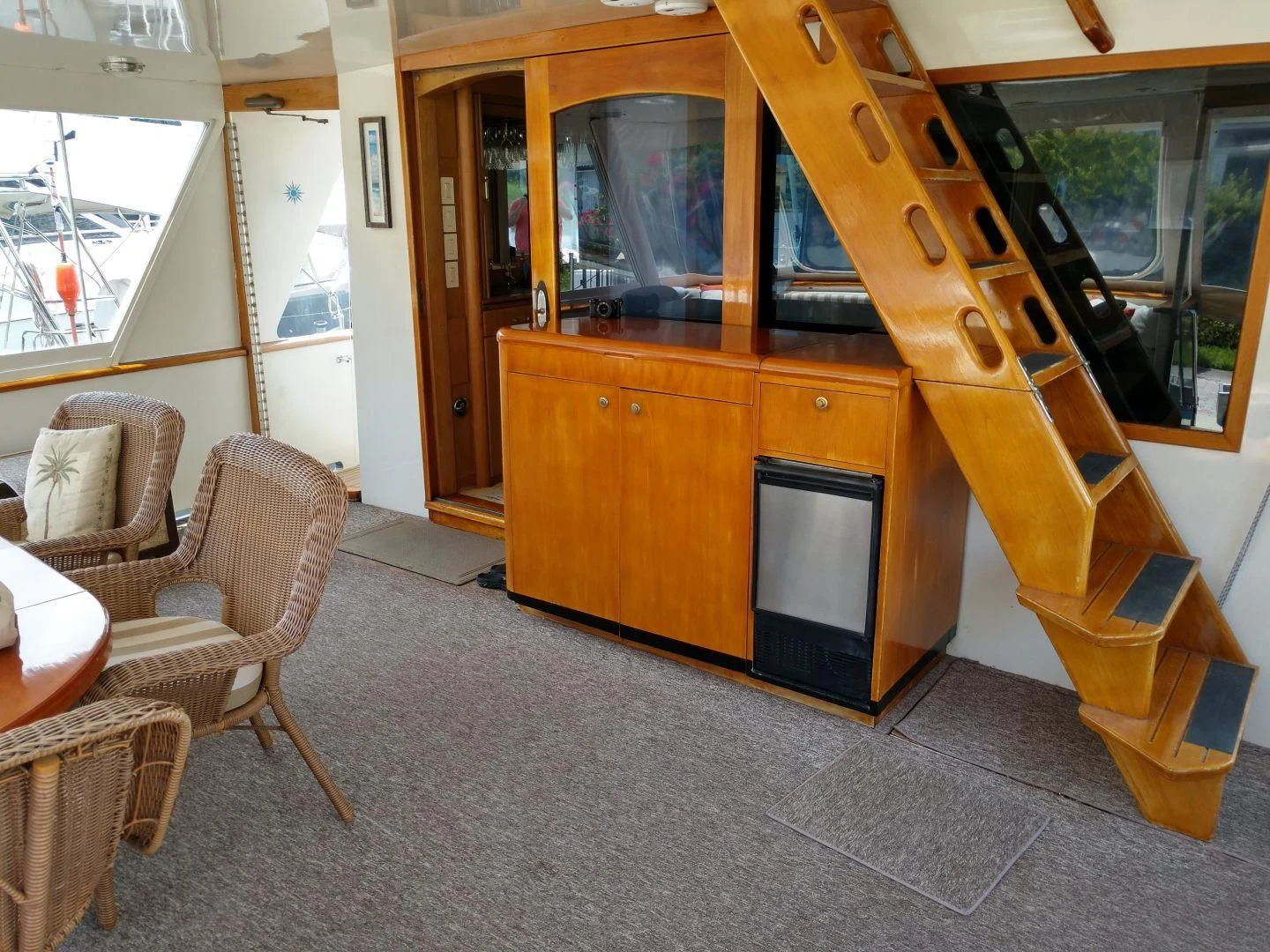 a room with a tv and chairs aboard CAROLE TOO Yacht for Sale