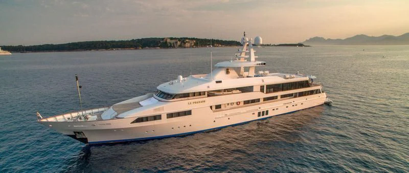 a large white boat on the water aboard LE PHARAON Yacht for Sale
