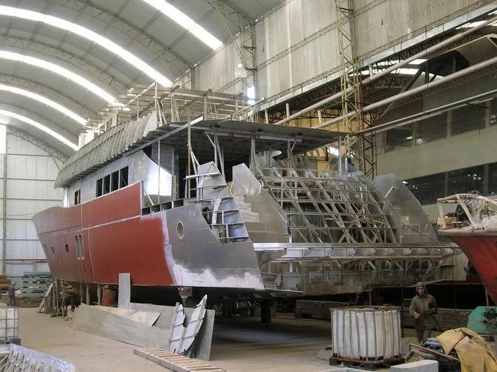 a large metal machine in a factory aboard ANDES Yacht for Sale