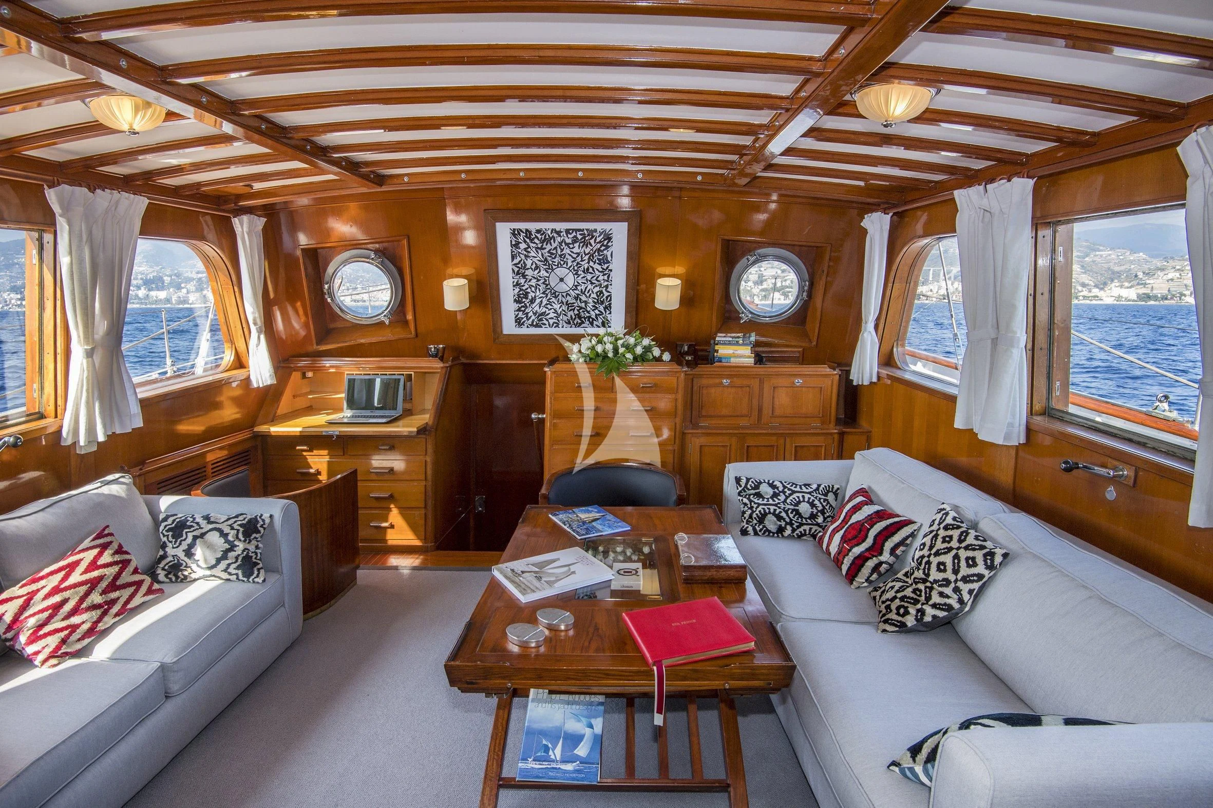 a living room with a couch and a coffee table aboard SEA PRINCE Yacht for Sale