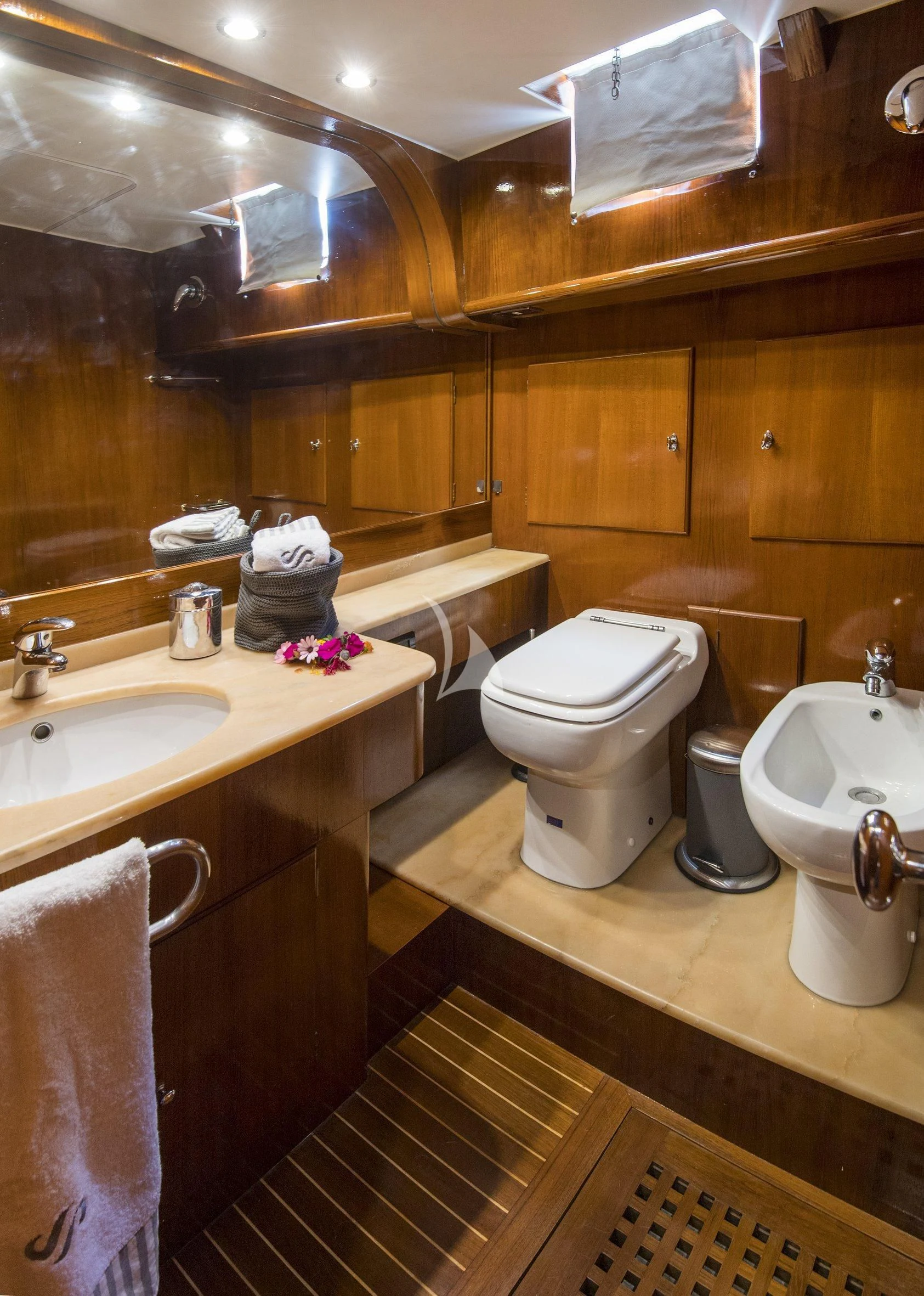 a bathroom with a toilet and sink aboard SEA PRINCE Yacht for Sale