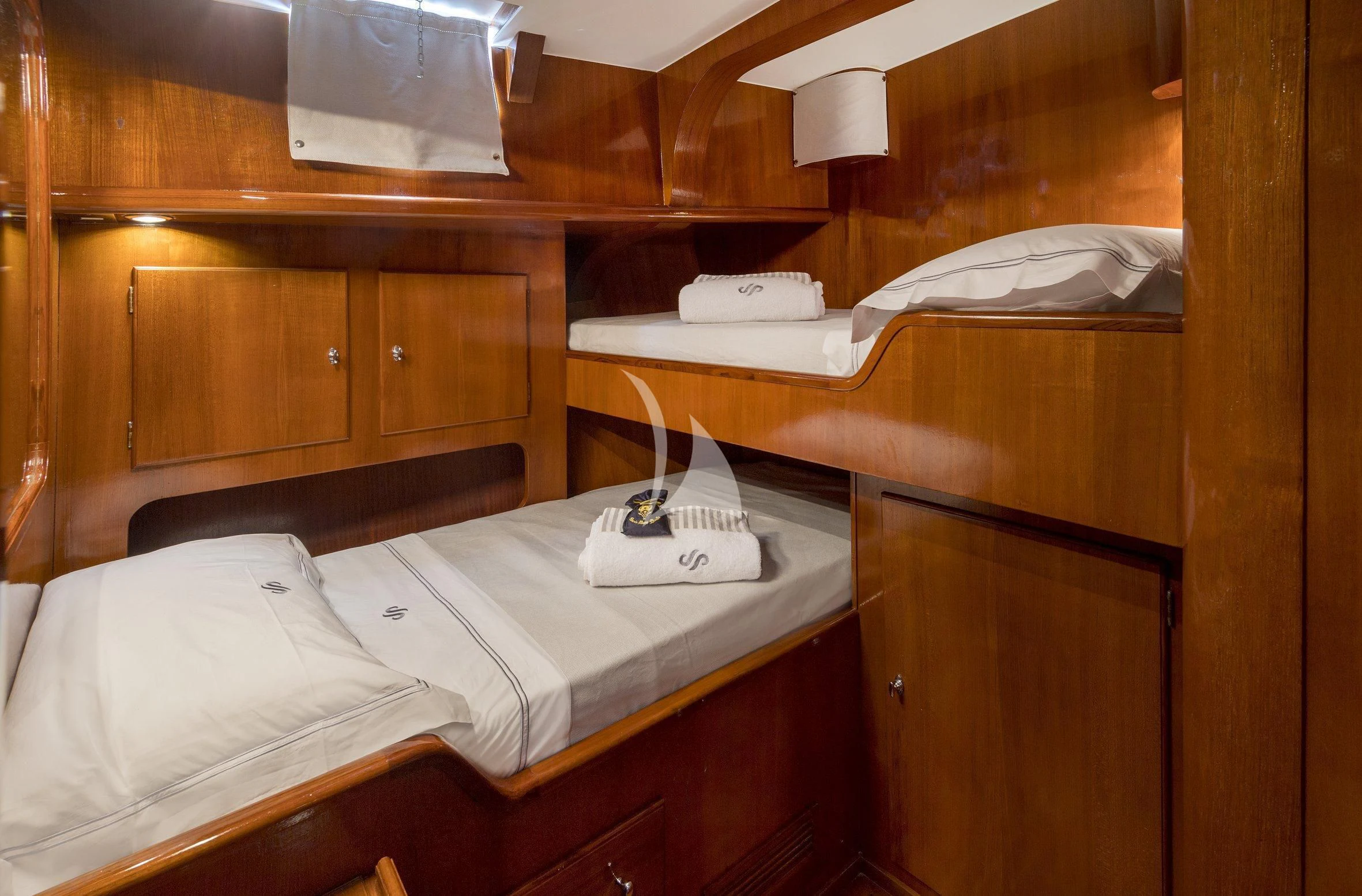 a bed with a white pillow and a white pillow on it aboard SEA PRINCE Yacht for Sale