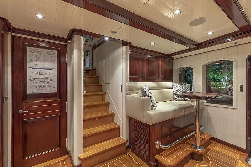 a room with a couch and a table aboard NADAN Yacht for Sale