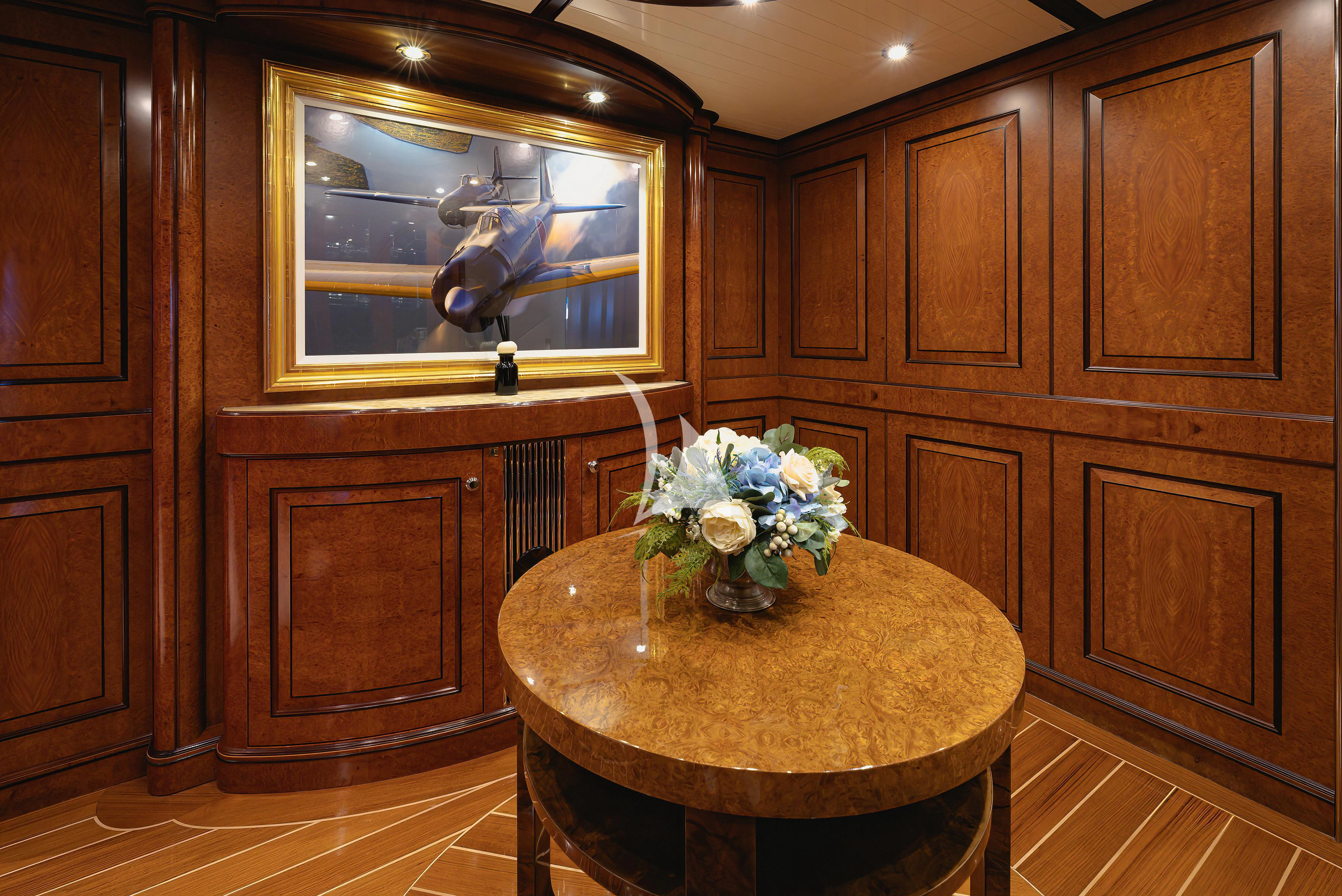 a wooden bathroom with a round table aboard NADAN Yacht for Sale