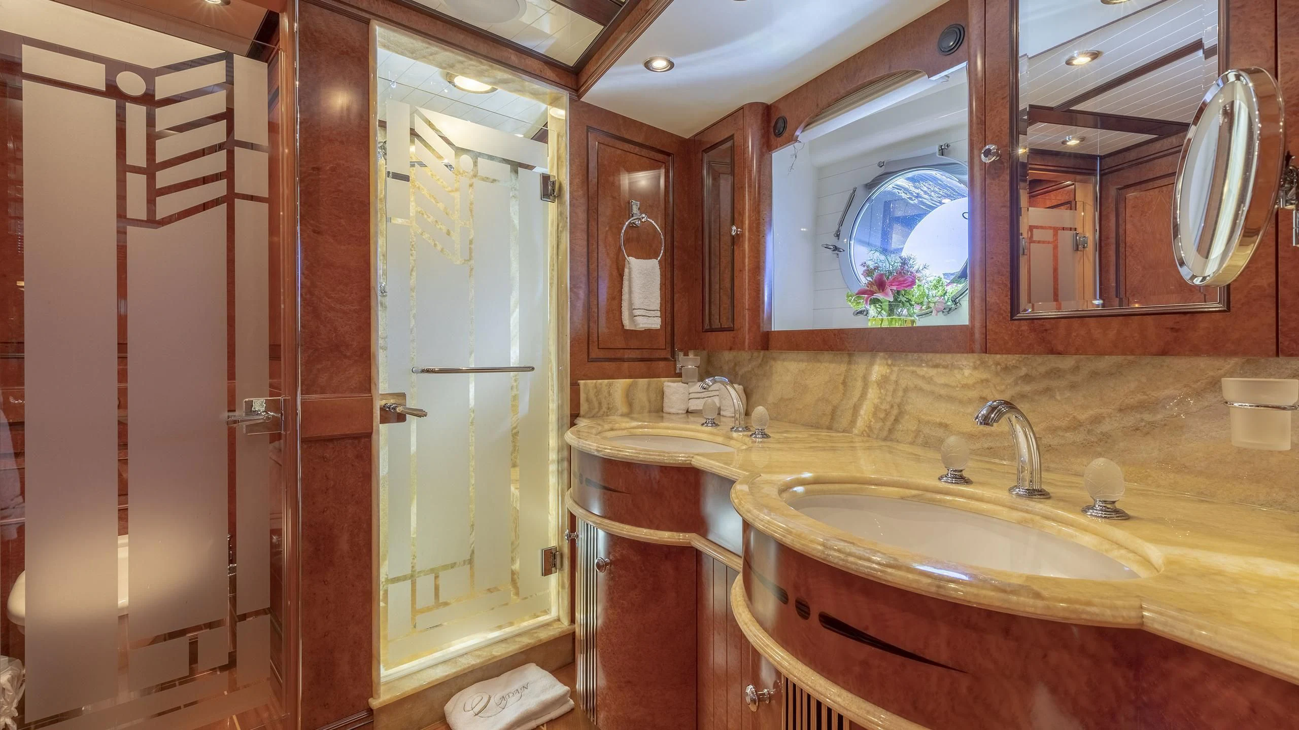 a bathroom with a sink and a mirror aboard NADAN Yacht for Sale