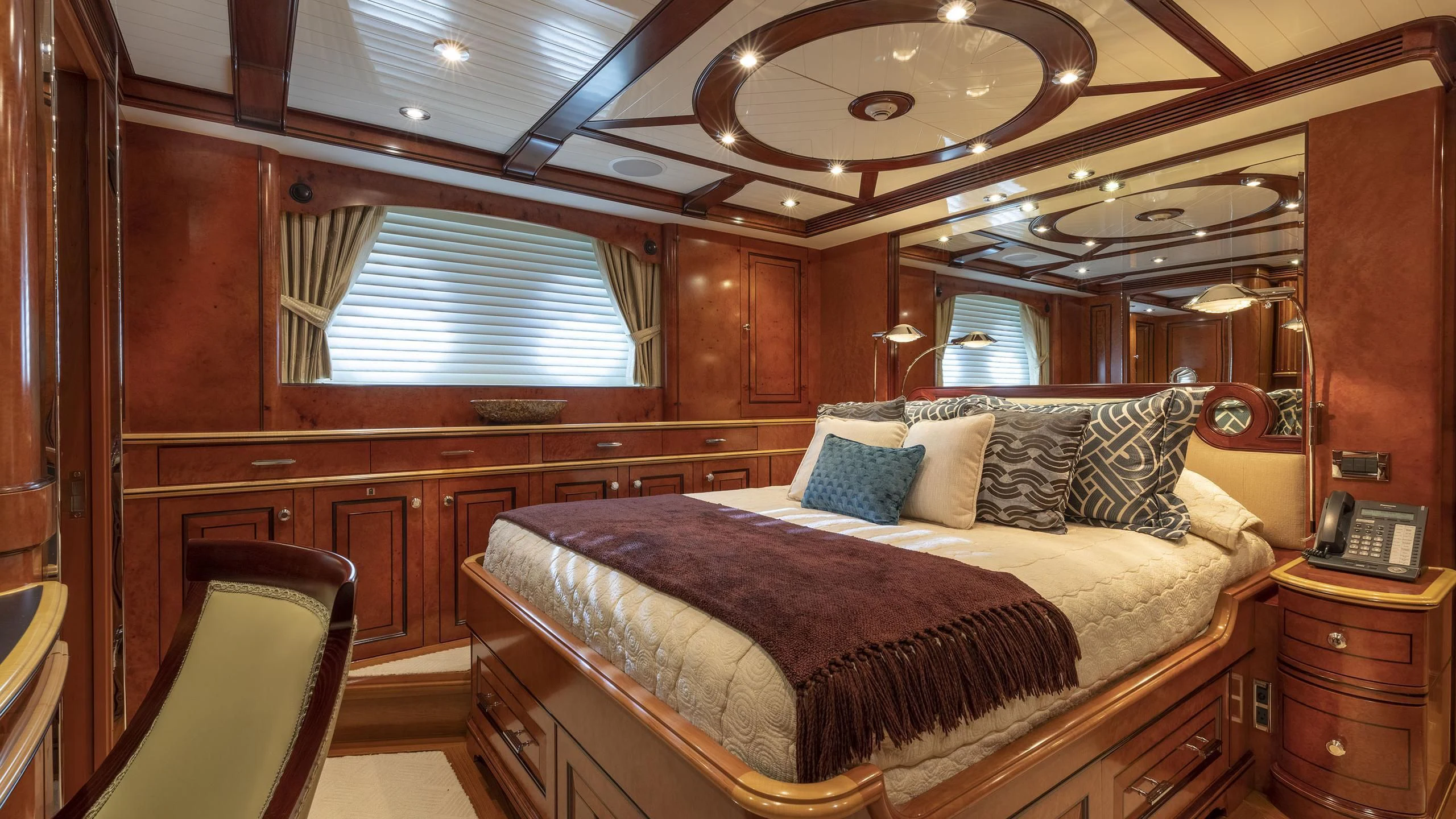 a bed in a room aboard NADAN Yacht for Sale