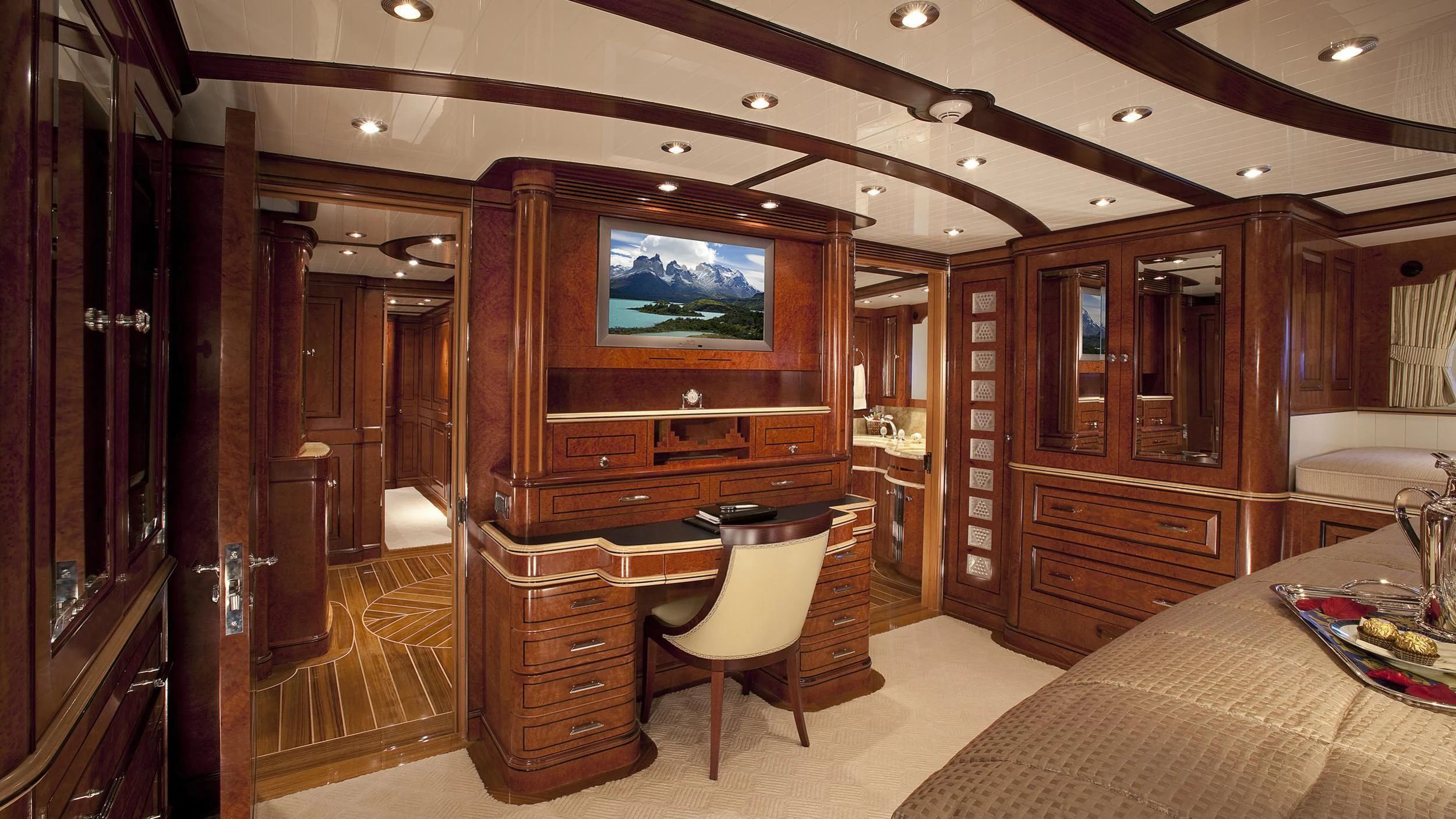 a room with a tv and a bed aboard NADAN Yacht for Sale