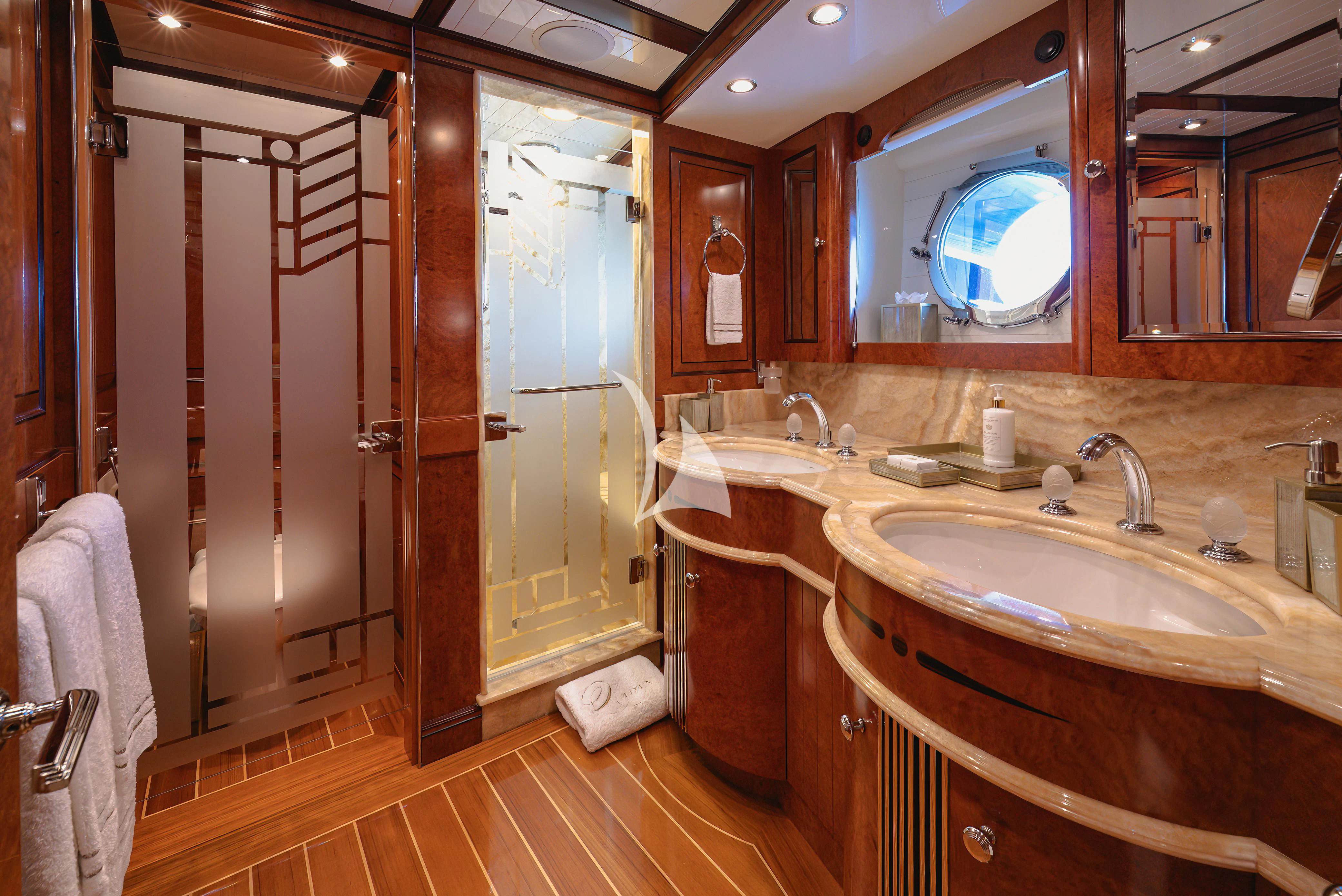 a bathroom with a sink and a mirror aboard NADAN Yacht for Sale