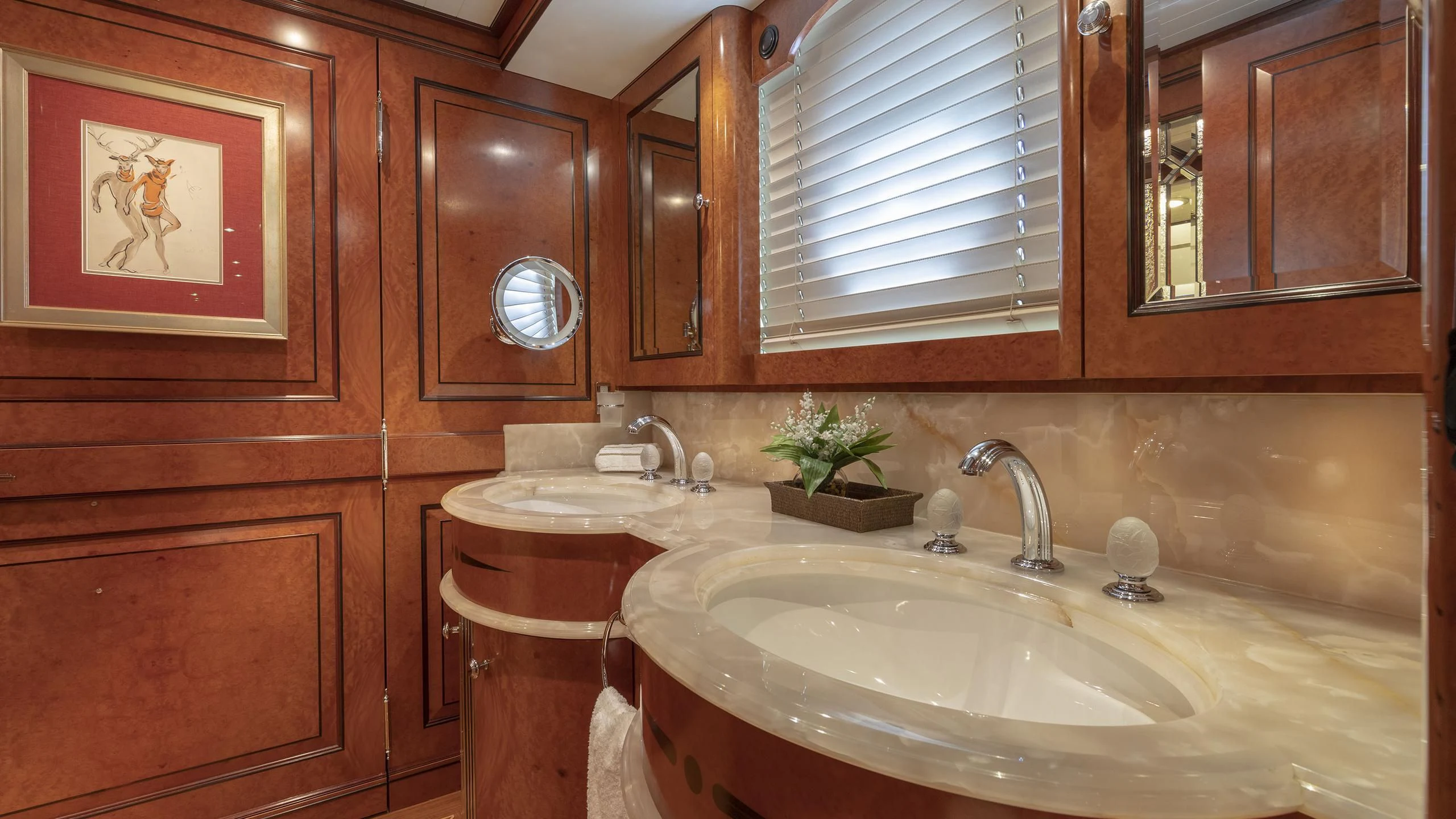 a bathroom with a sink and cabinets aboard NADAN Yacht for Sale