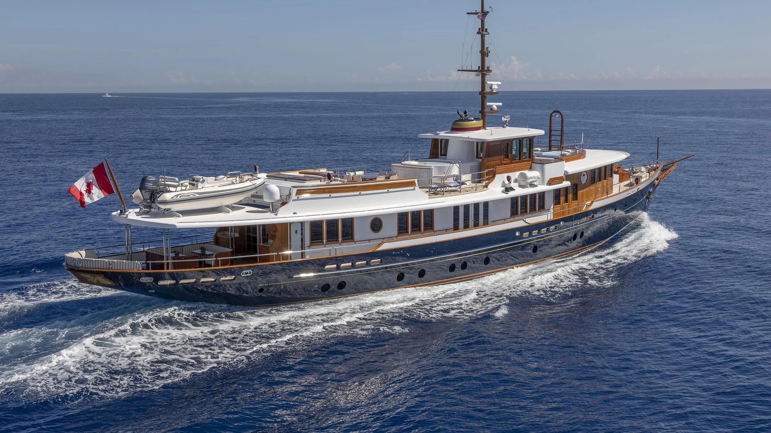 a large ship in the water aboard NADAN Yacht for Sale