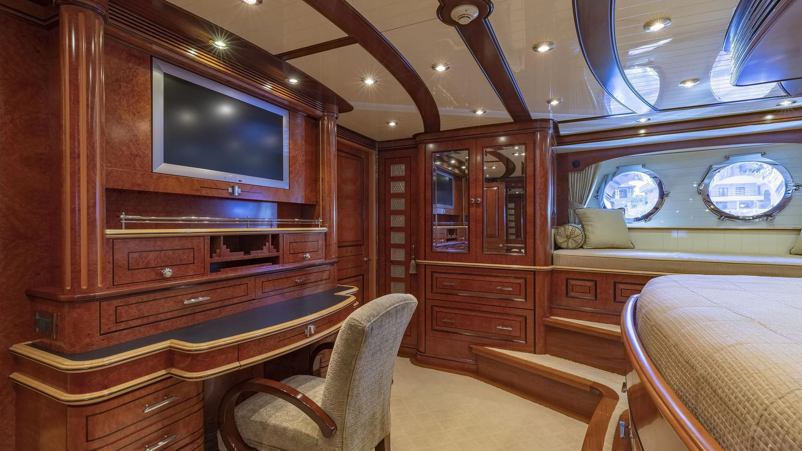 a room with a tv and a dresser aboard NADAN Yacht for Sale